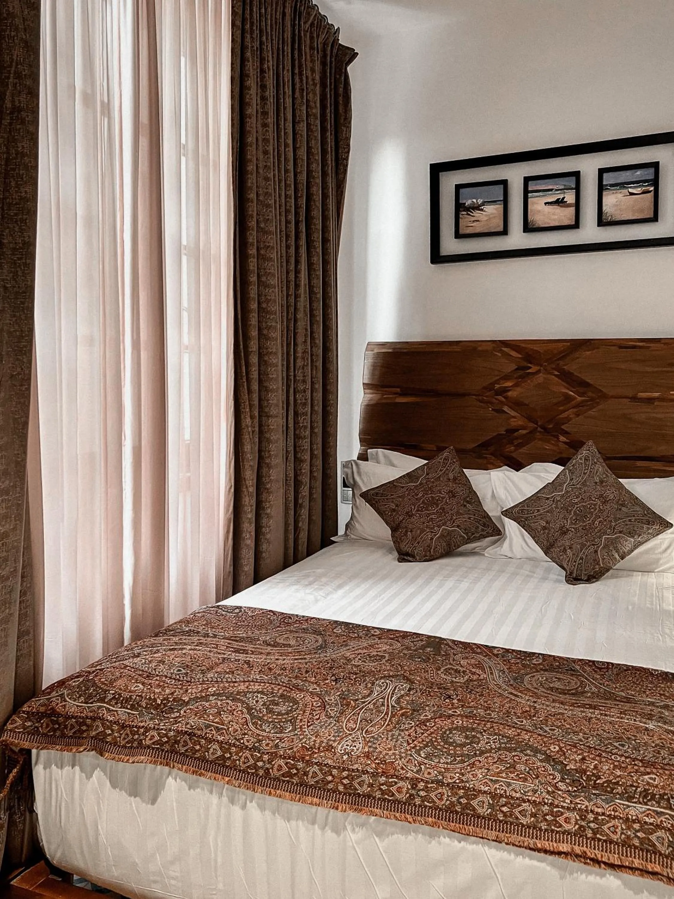 Bed in Anahita Boutique Hotel