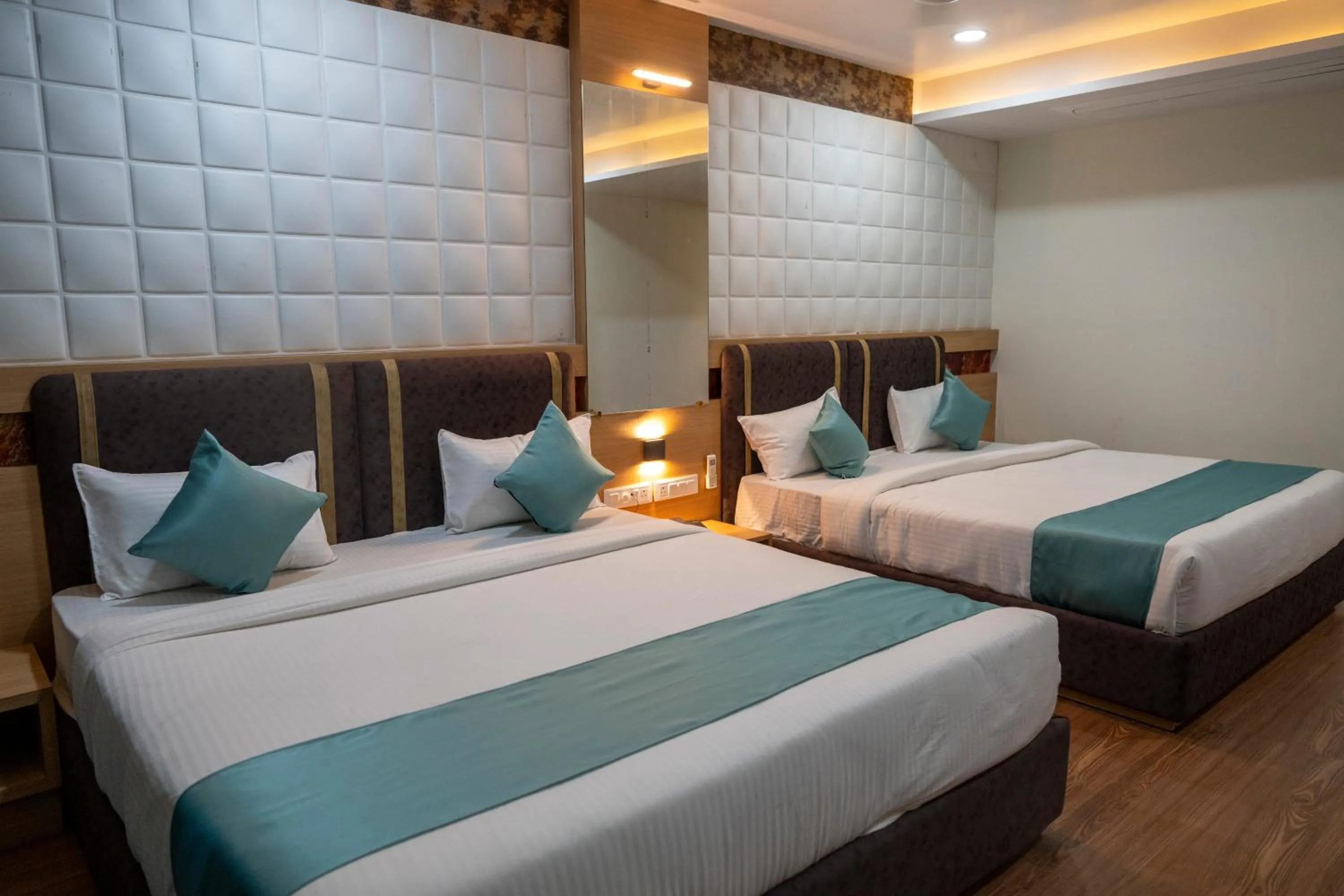 Bed in THE GRAND ASTORIA SOMANTH by Shivalaya Darshanam