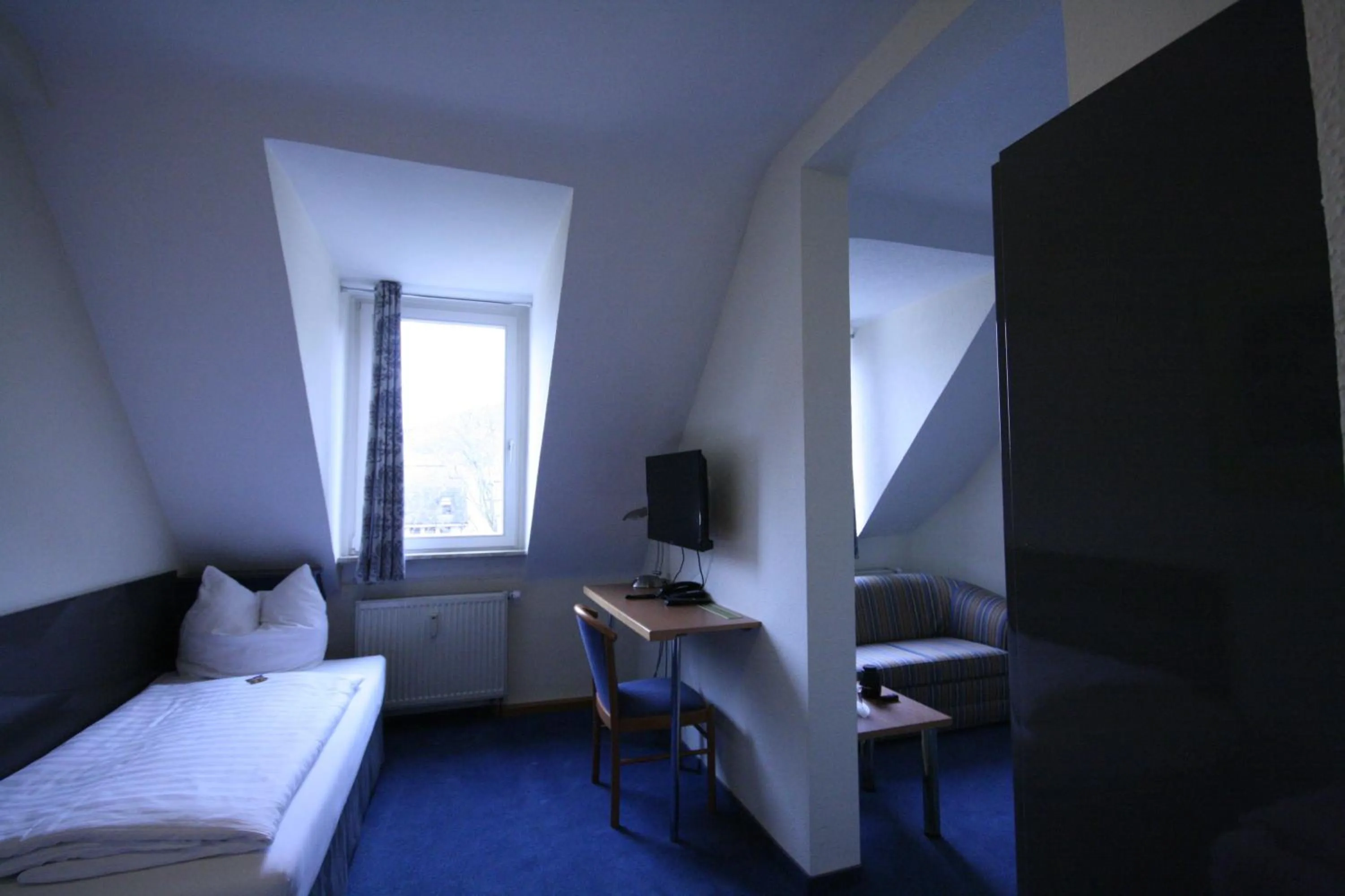 Photo of the whole room, Bed in Altstadt Hotel