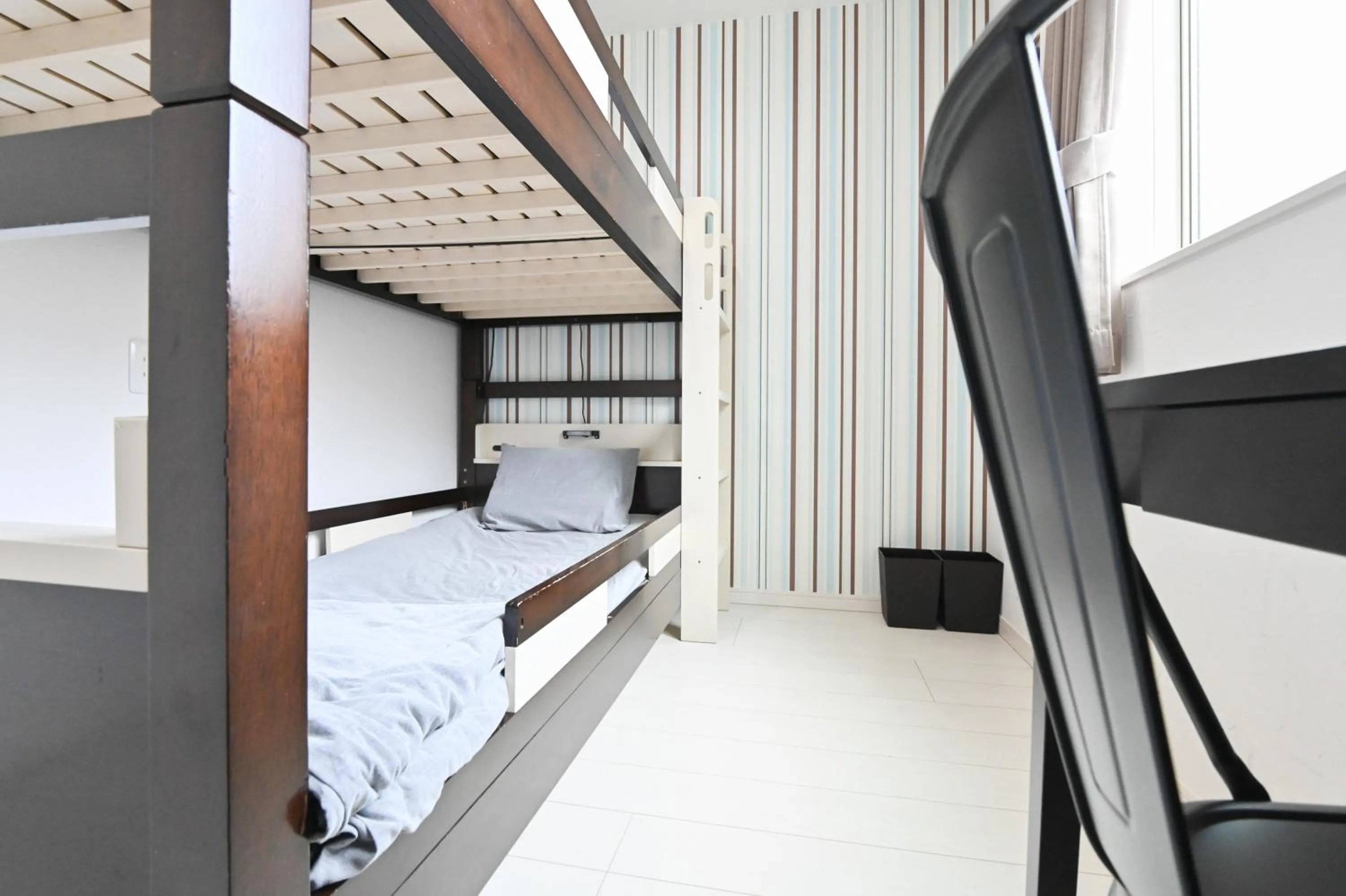 Bed in RUMa INN Rokugoudote