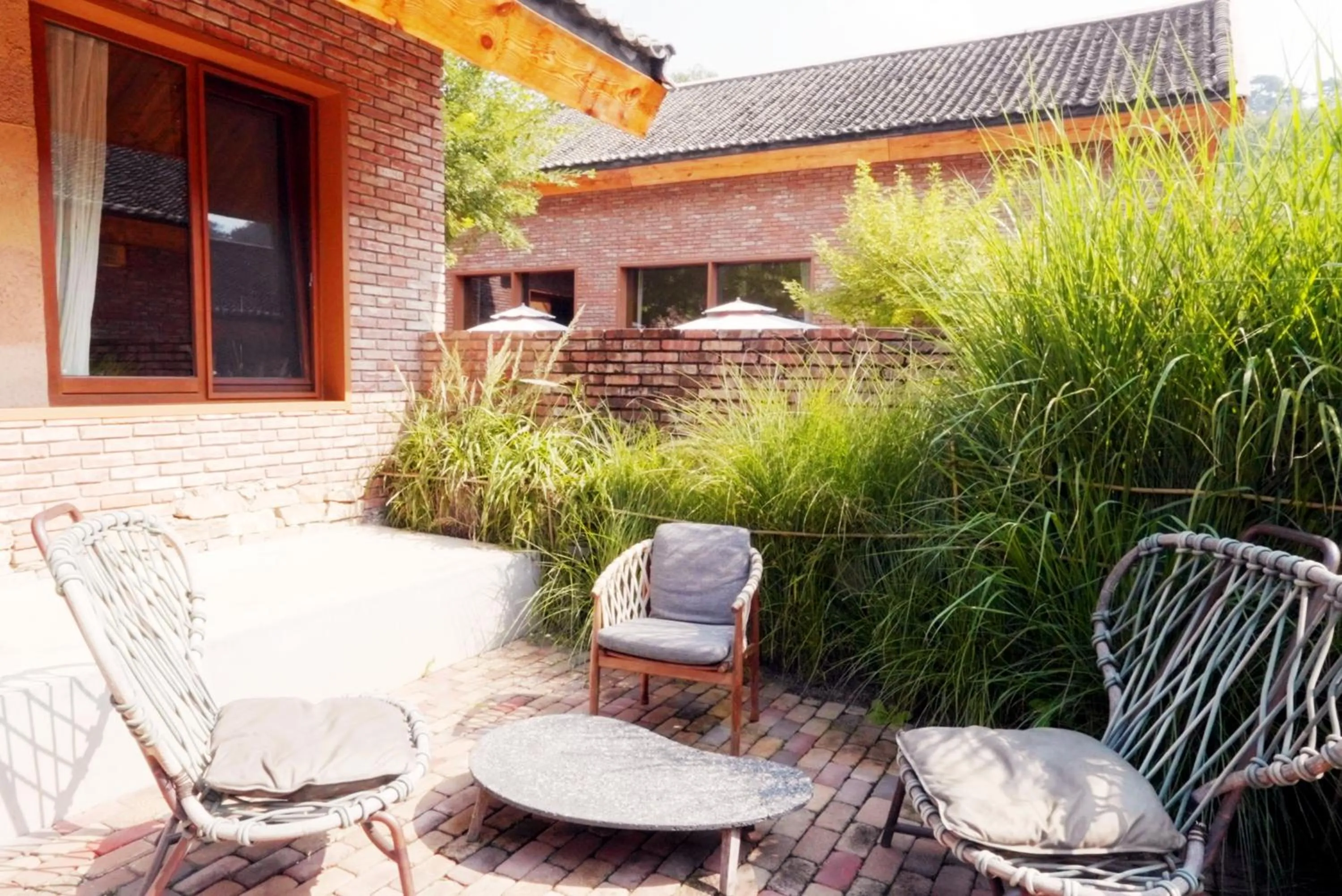 Garden in Sansa Village Boutique Hotel at Mutianyu Great Wall Adjoin to Mutianyu Great Wall - Room with the View of Great Wall - Jacuzzi with the View of Great Wall - Vehicle Shuttle Service - International Catering - SPA& Nail Beauty Facilities