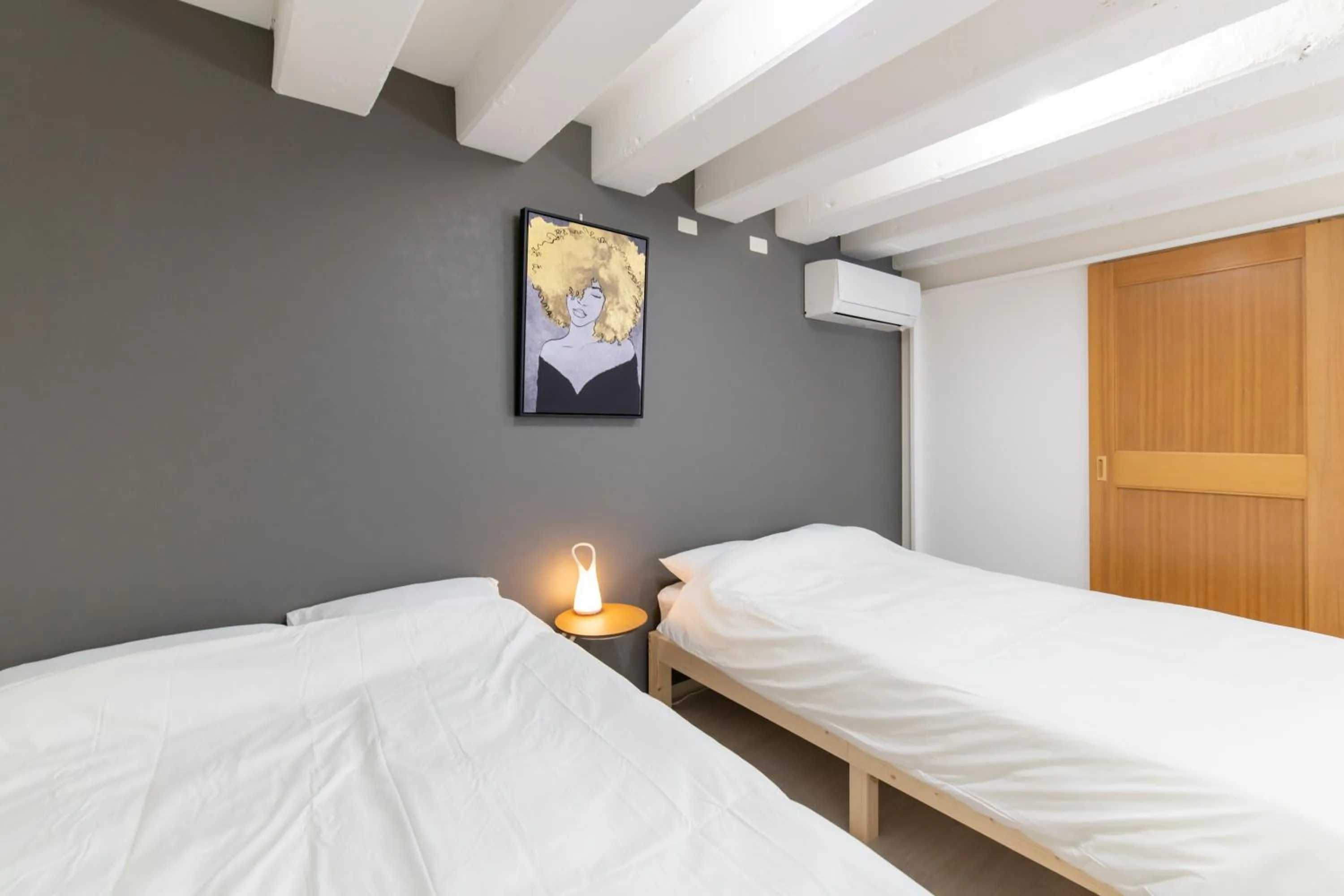 Bed in LUANAHOTEL IN NAKANO