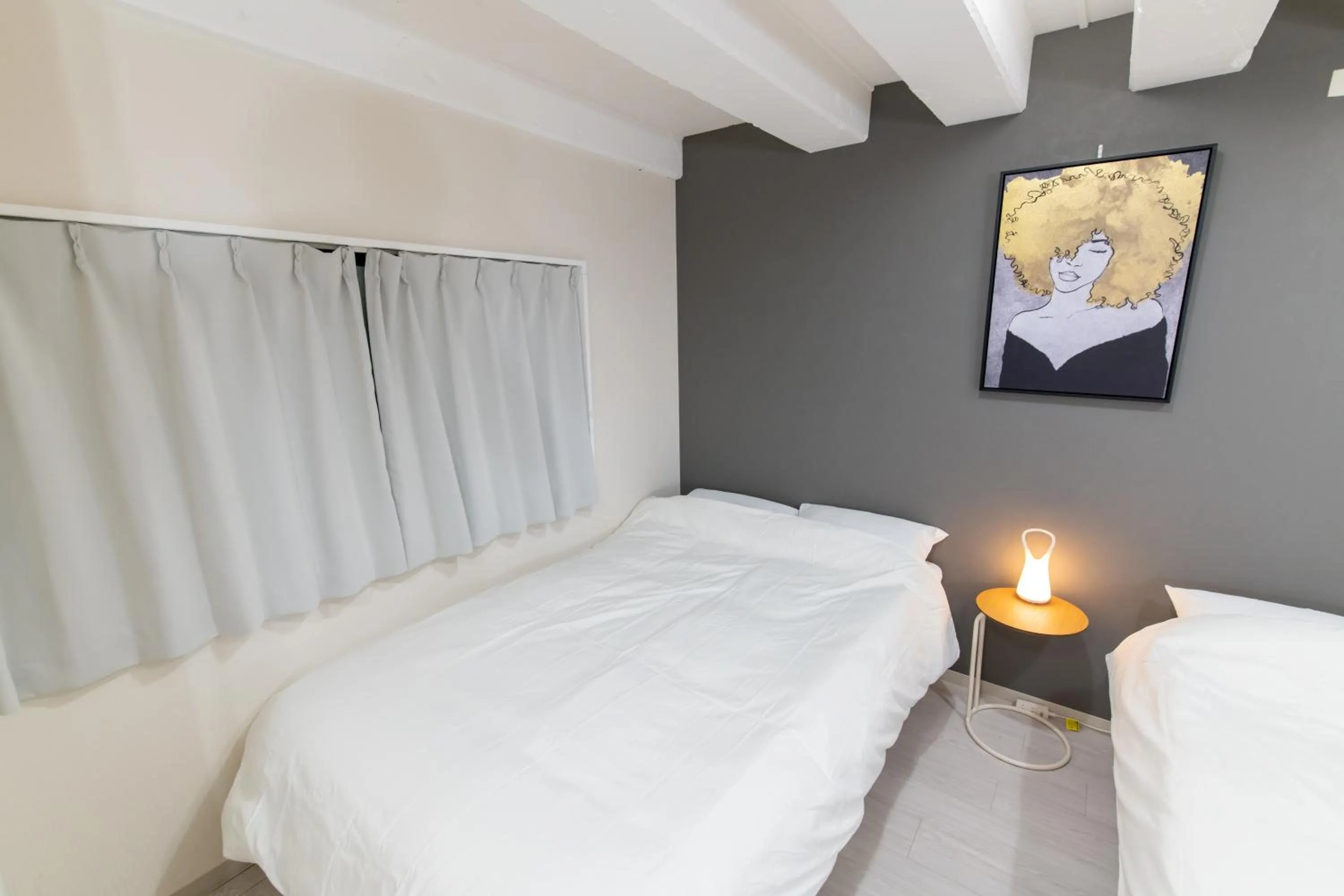 Bed in LUANAHOTEL IN NAKANO