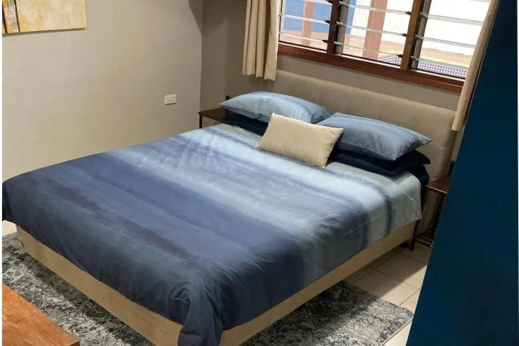 Bed in Vanuatu Beachfront Apartments