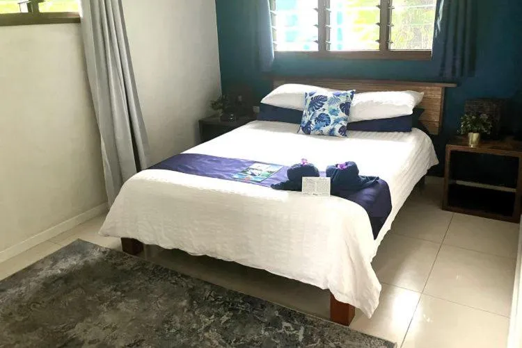 Bed in Vanuatu Beachfront Apartments