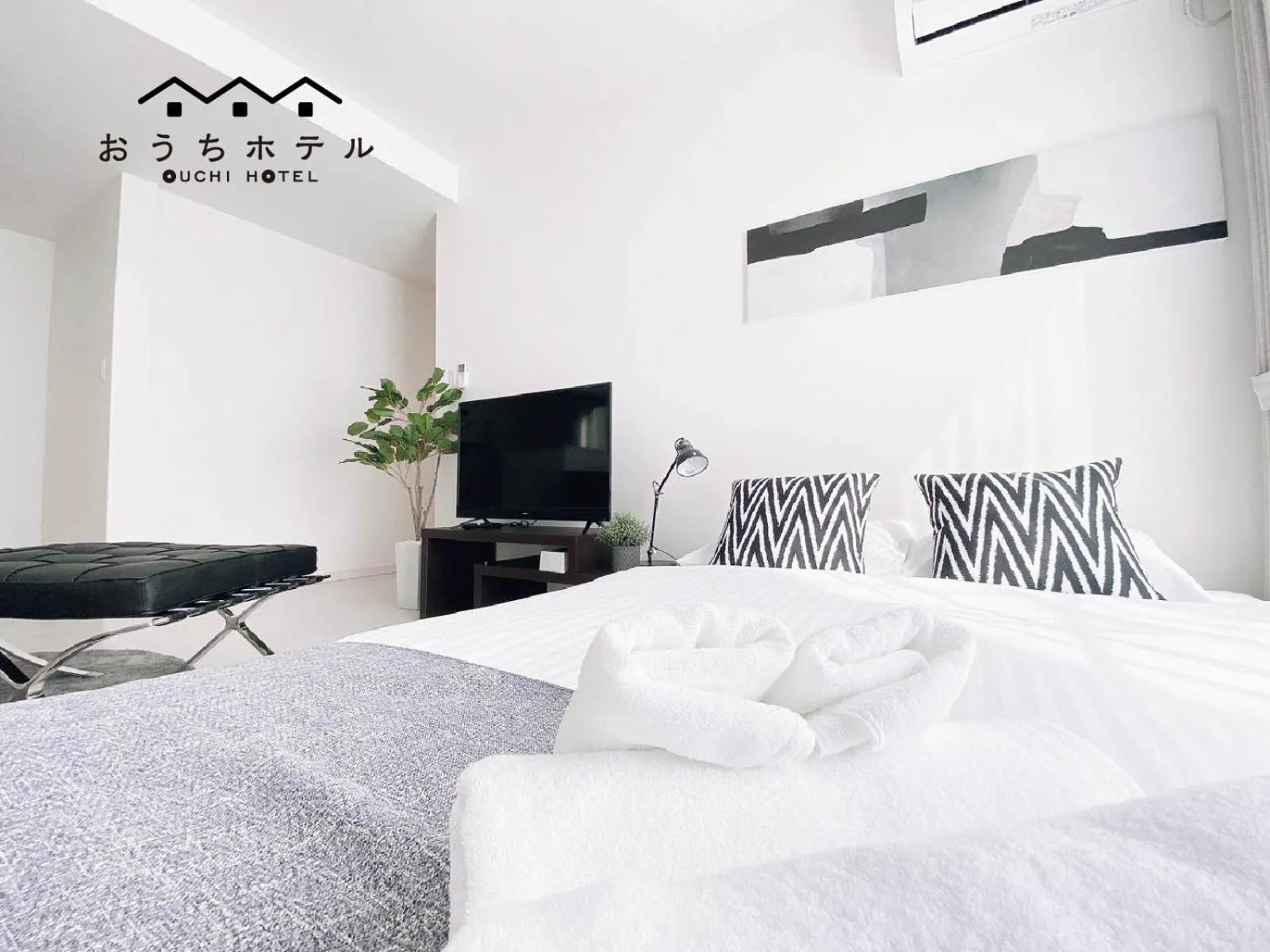 Bed in OUCHI HOTEL Hatsukaichi-Ekimae