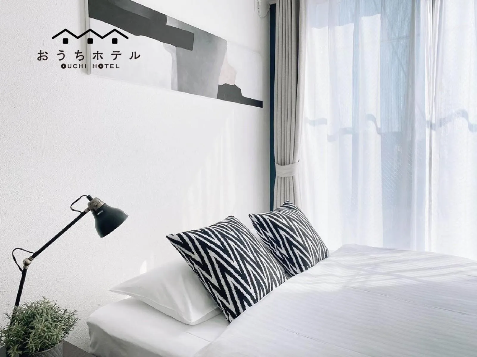 Bed in OUCHI HOTEL Hatsukaichi-Ekimae