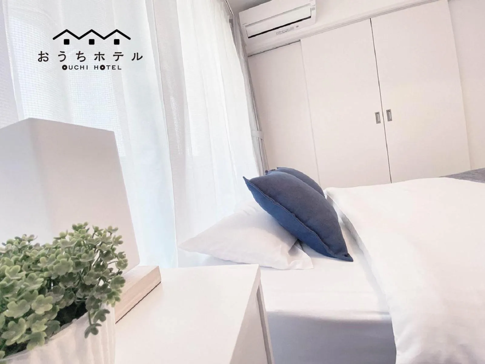 Bed in OUCHI HOTEL Miyajimaguchi