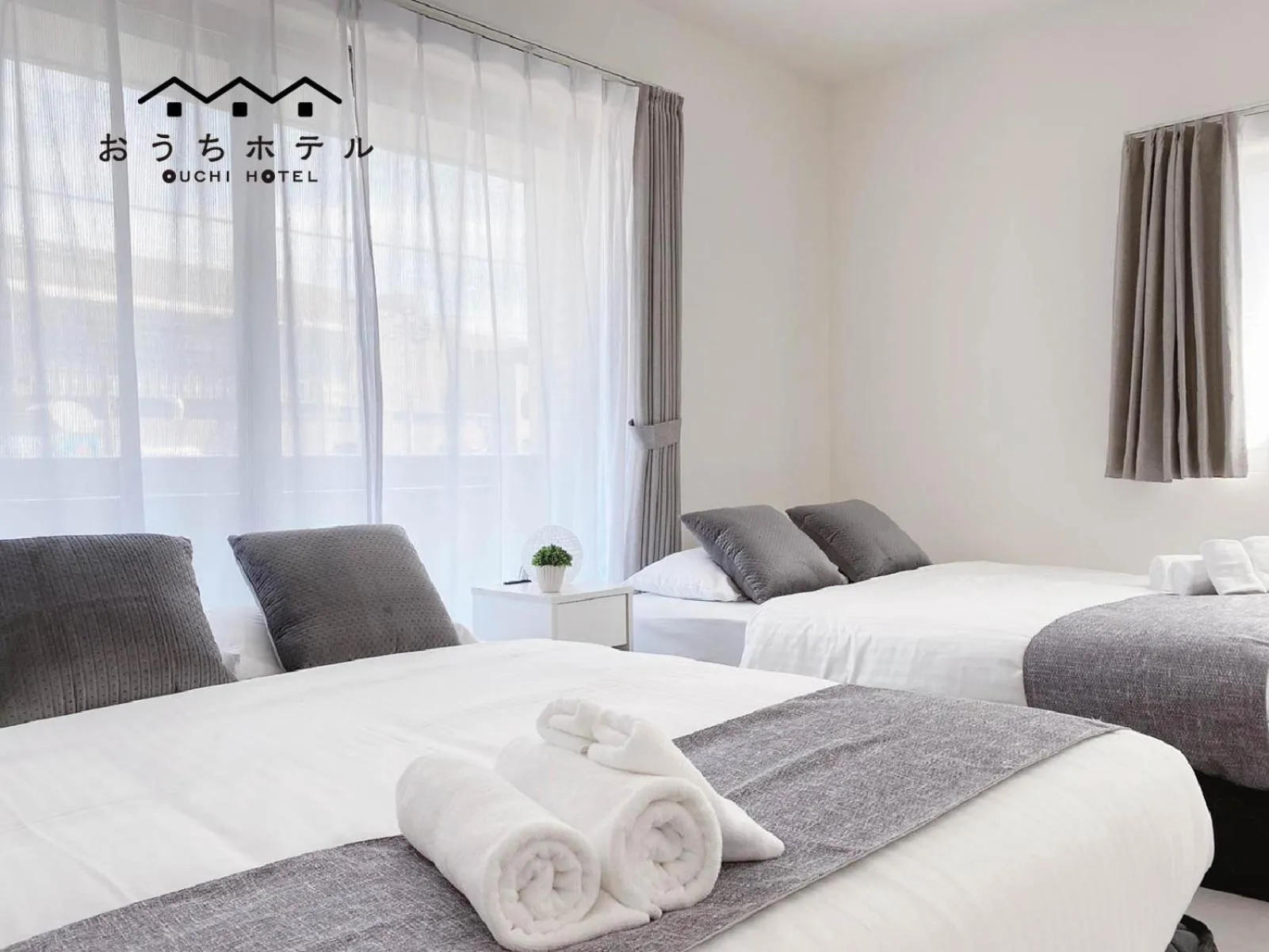 Bed in OUCHI HOTEL Miyajimaguchi