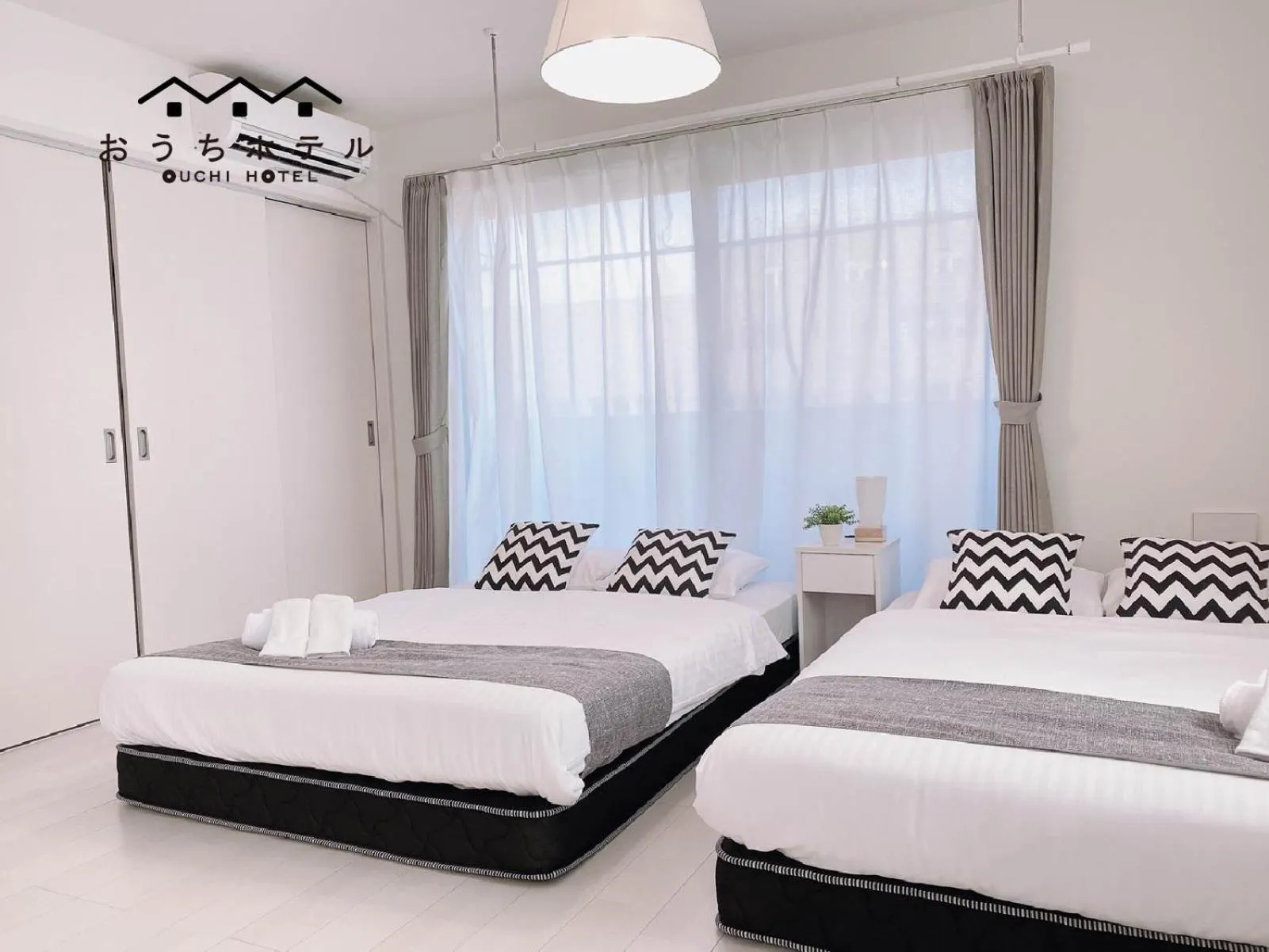 Bed in OUCHI HOTEL Miyajimaguchi