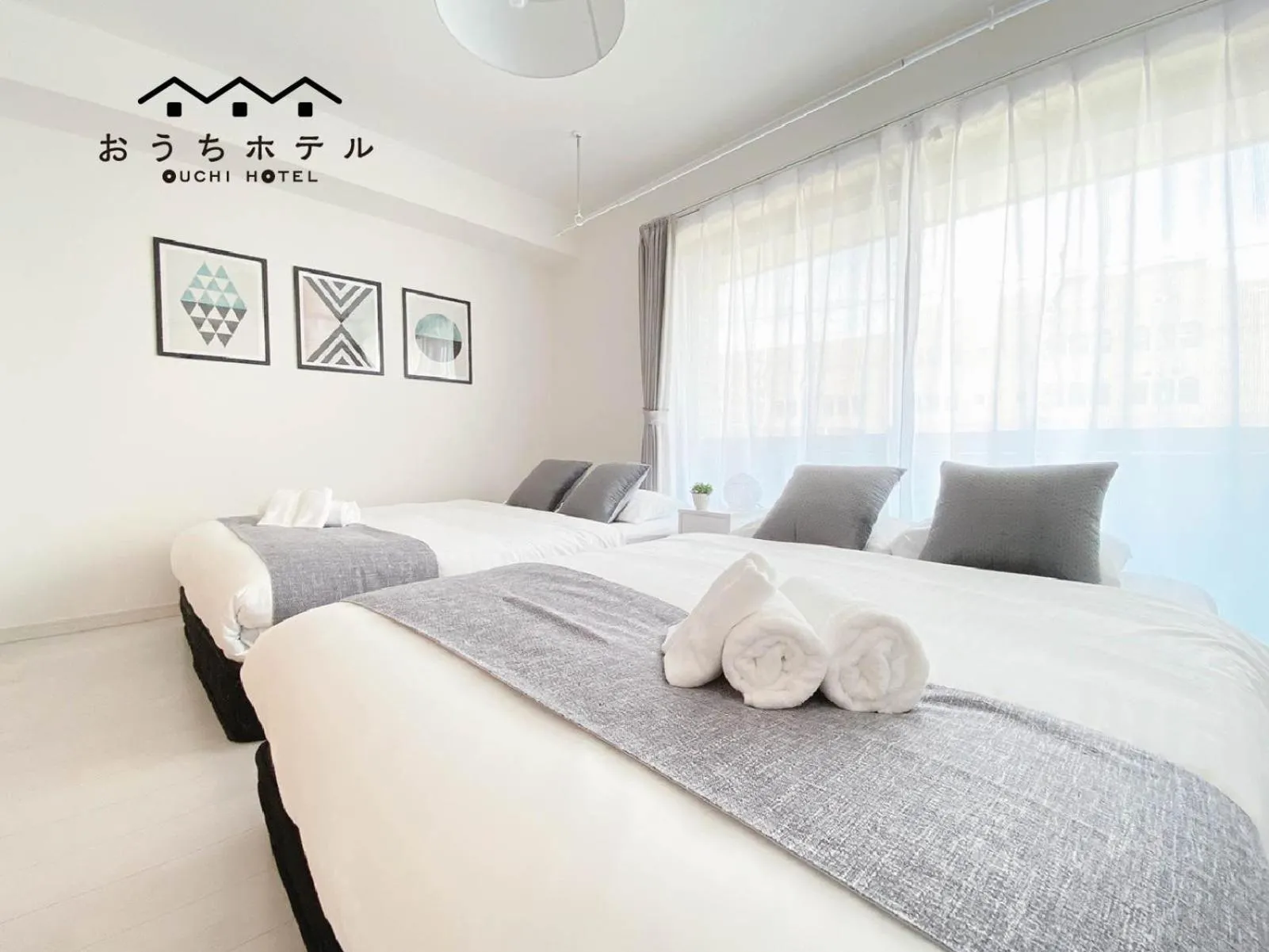 Bed in OUCHI HOTEL Miyajimaguchi