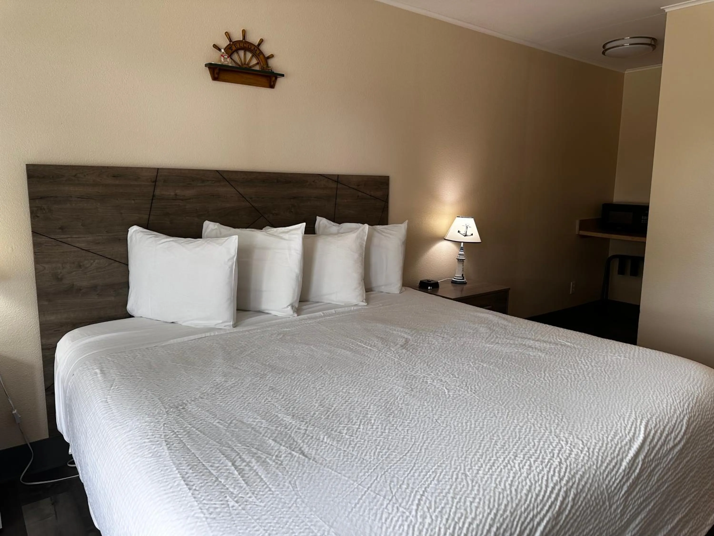 Bed in Coastal Inn and Suites