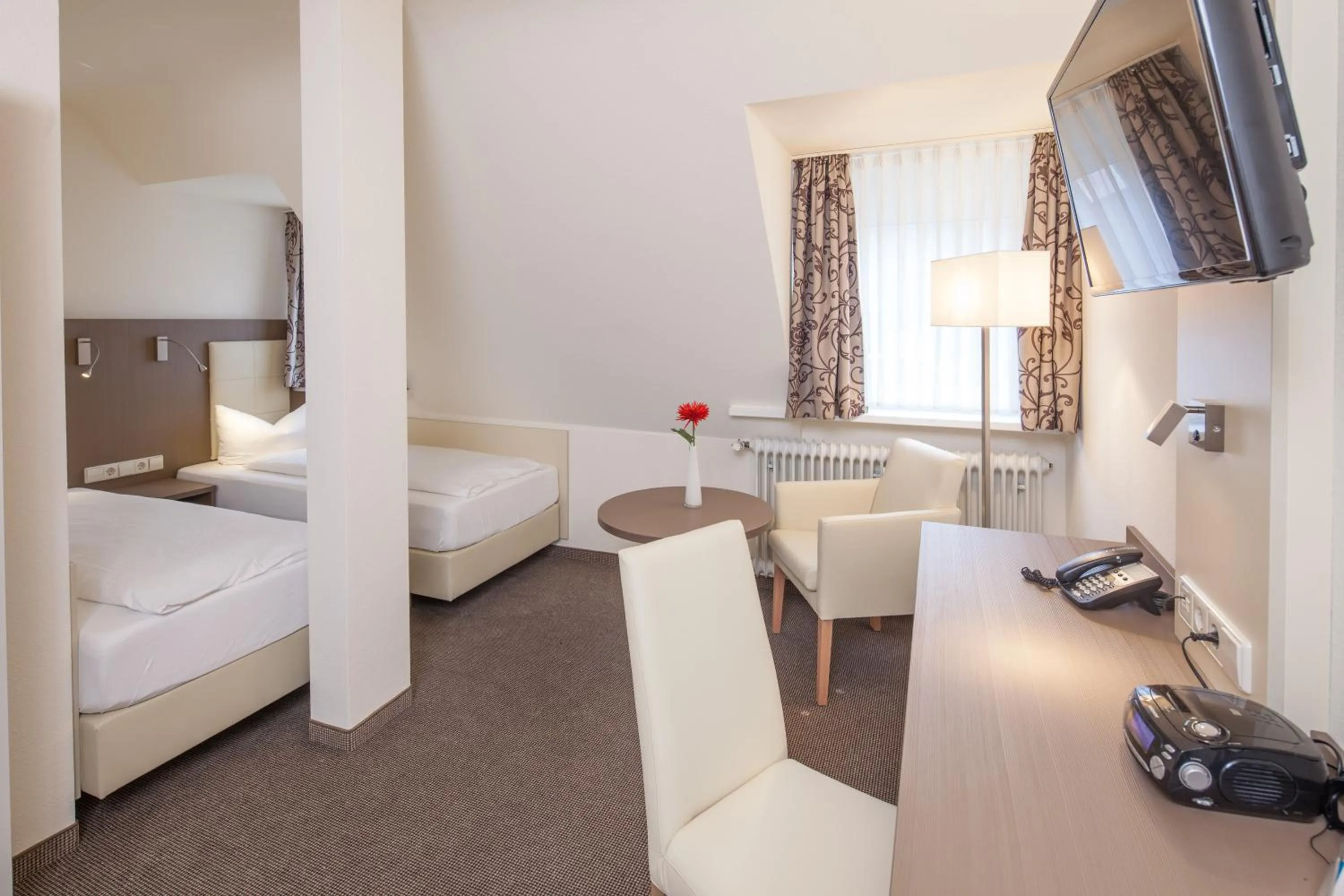 Photo of the whole room, Bed in City Hotel Freiburg