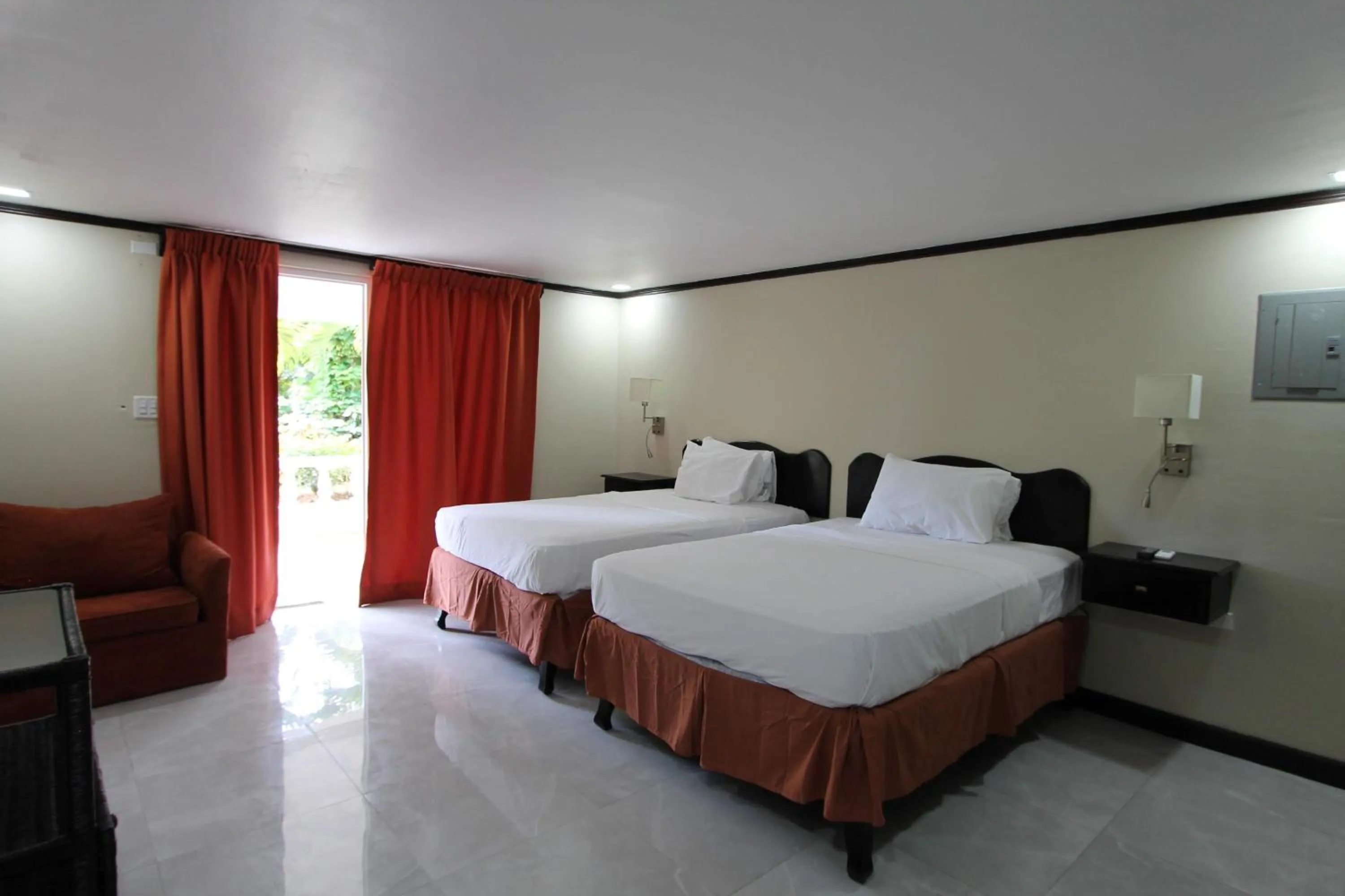 Bed in Sand and Blue Seas