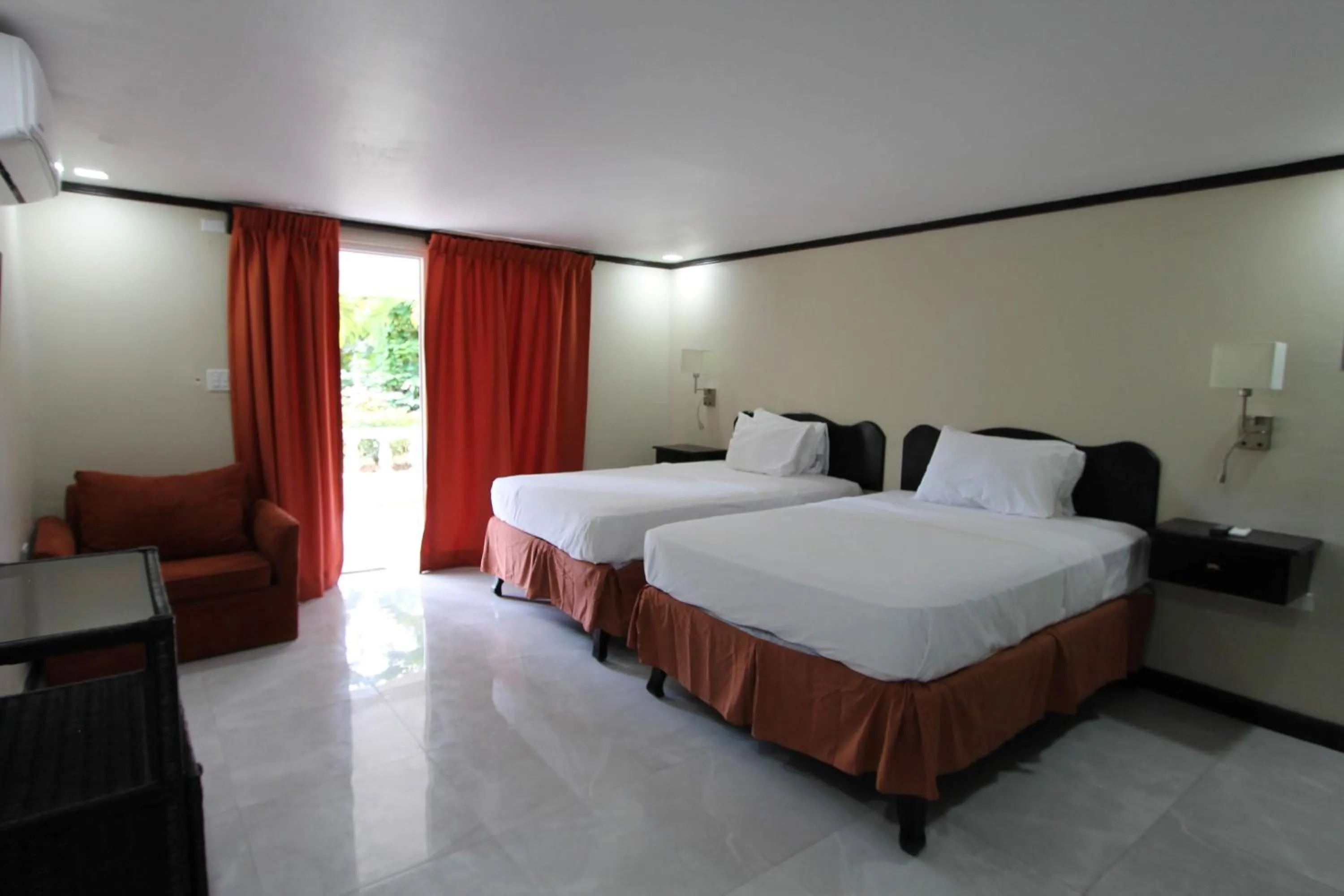 Bed in Sand and Blue Seas