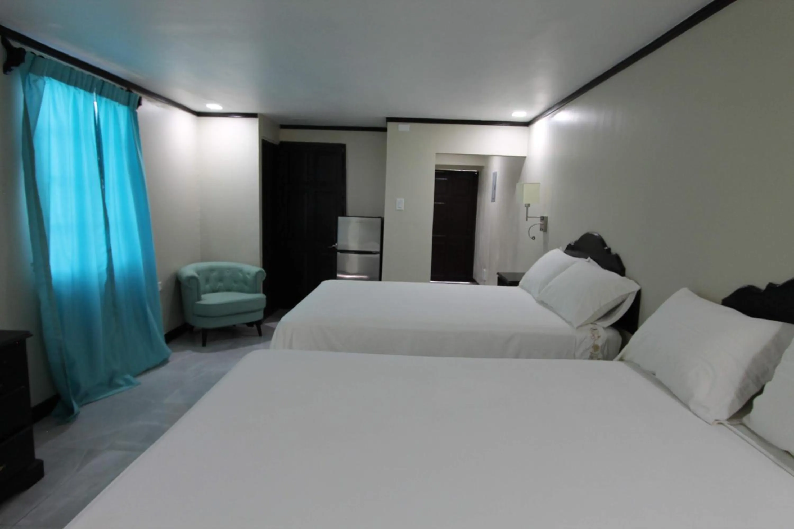 Bed in Sand and Blue Seas