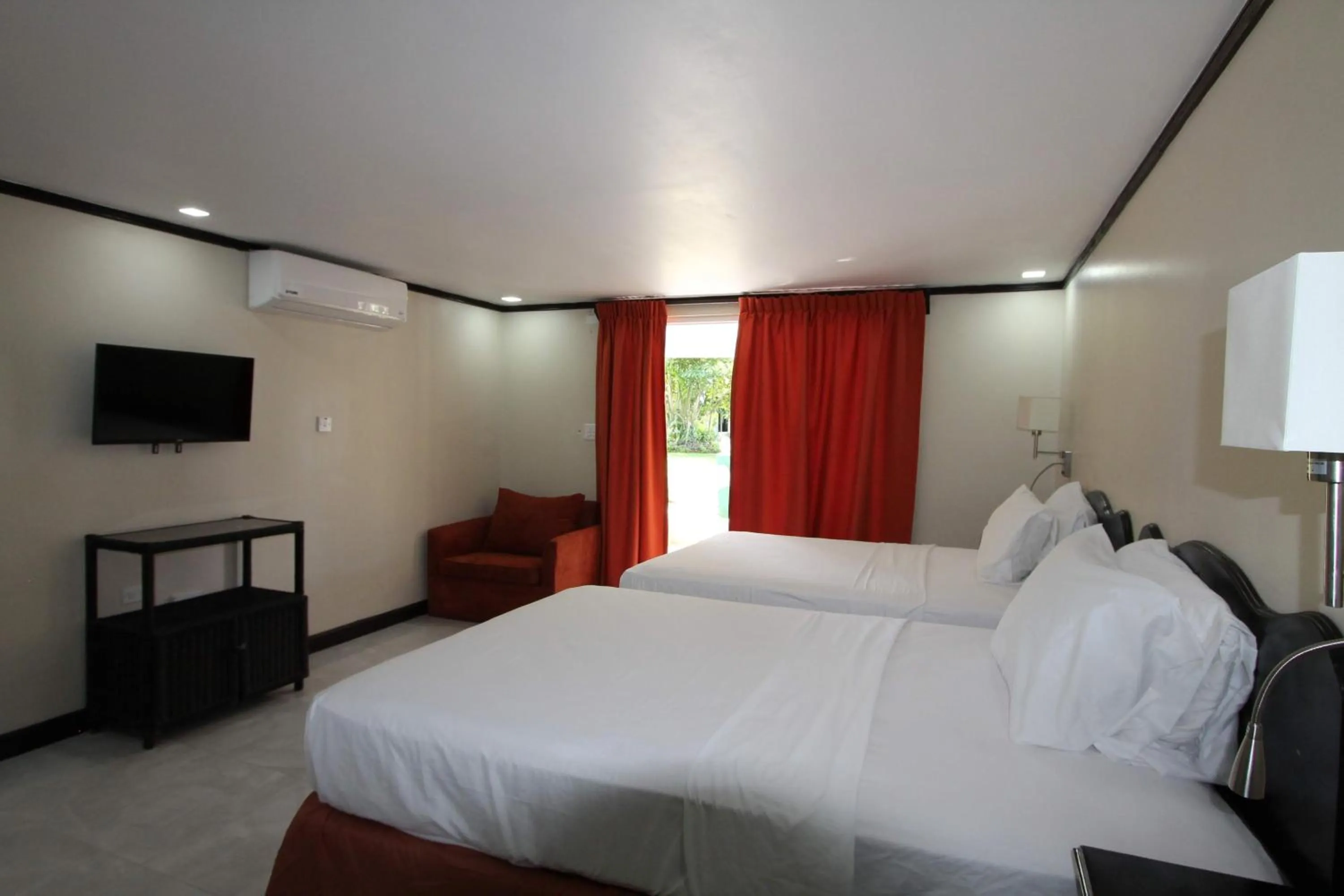 Bed in Sand and Blue Seas