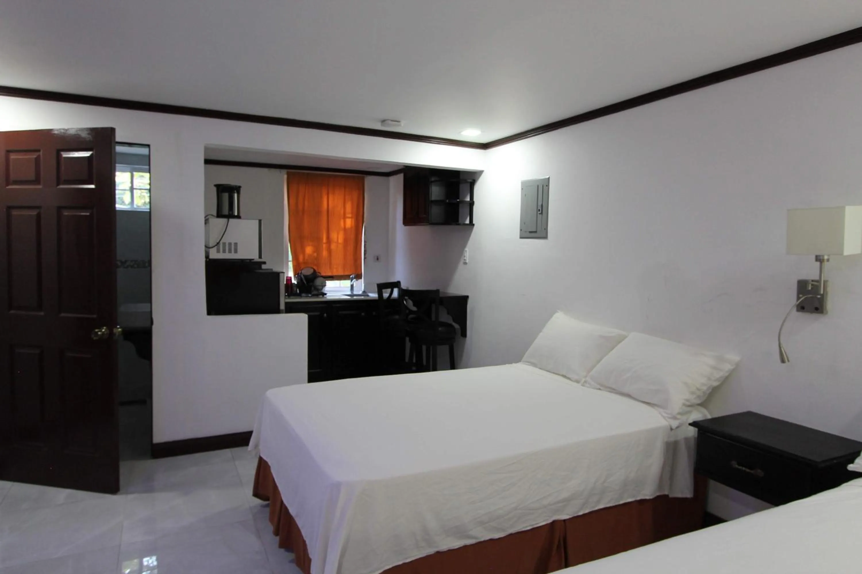 Photo of the whole room, Bed in Sand and Blue Seas