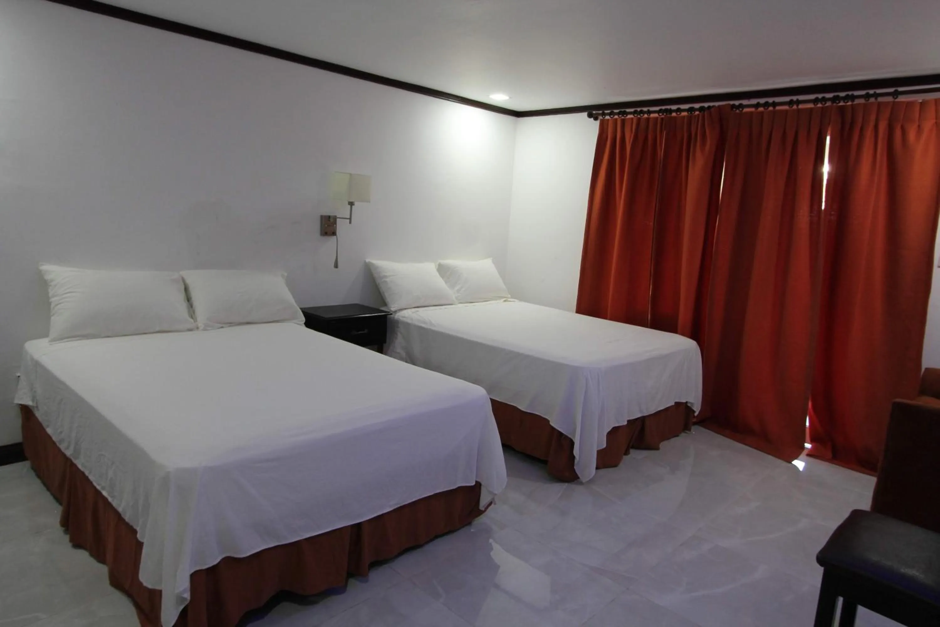 Photo of the whole room, Bed in Sand and Blue Seas