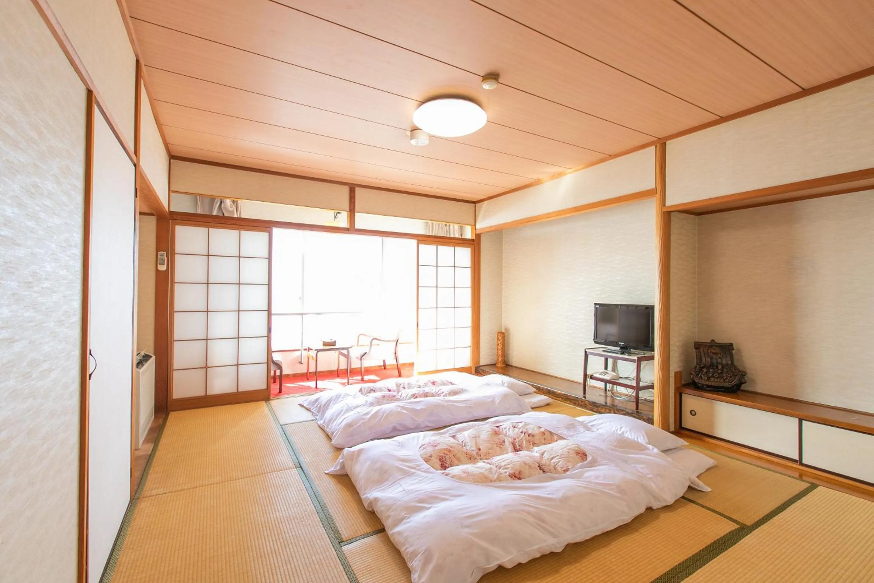 Photo of the whole room, Bed in Tabist Setouchinoyado Takehara Seaside