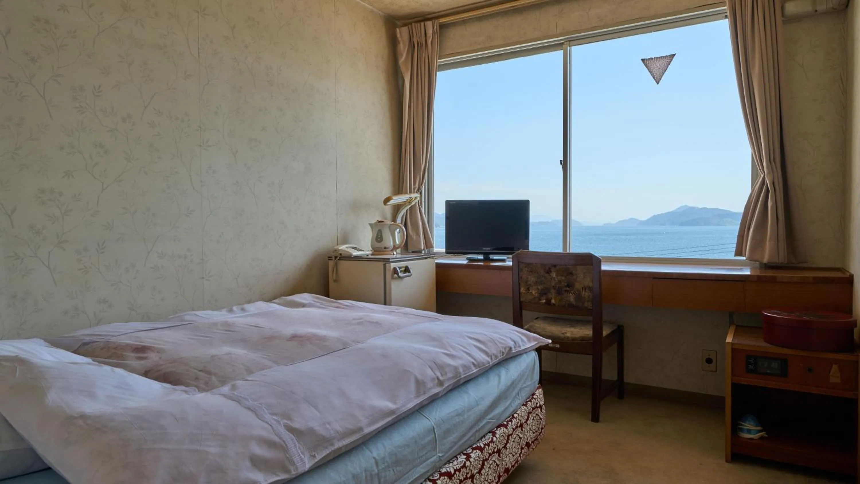 Photo of the whole room, Bed in Tabist Setouchinoyado Takehara Seaside