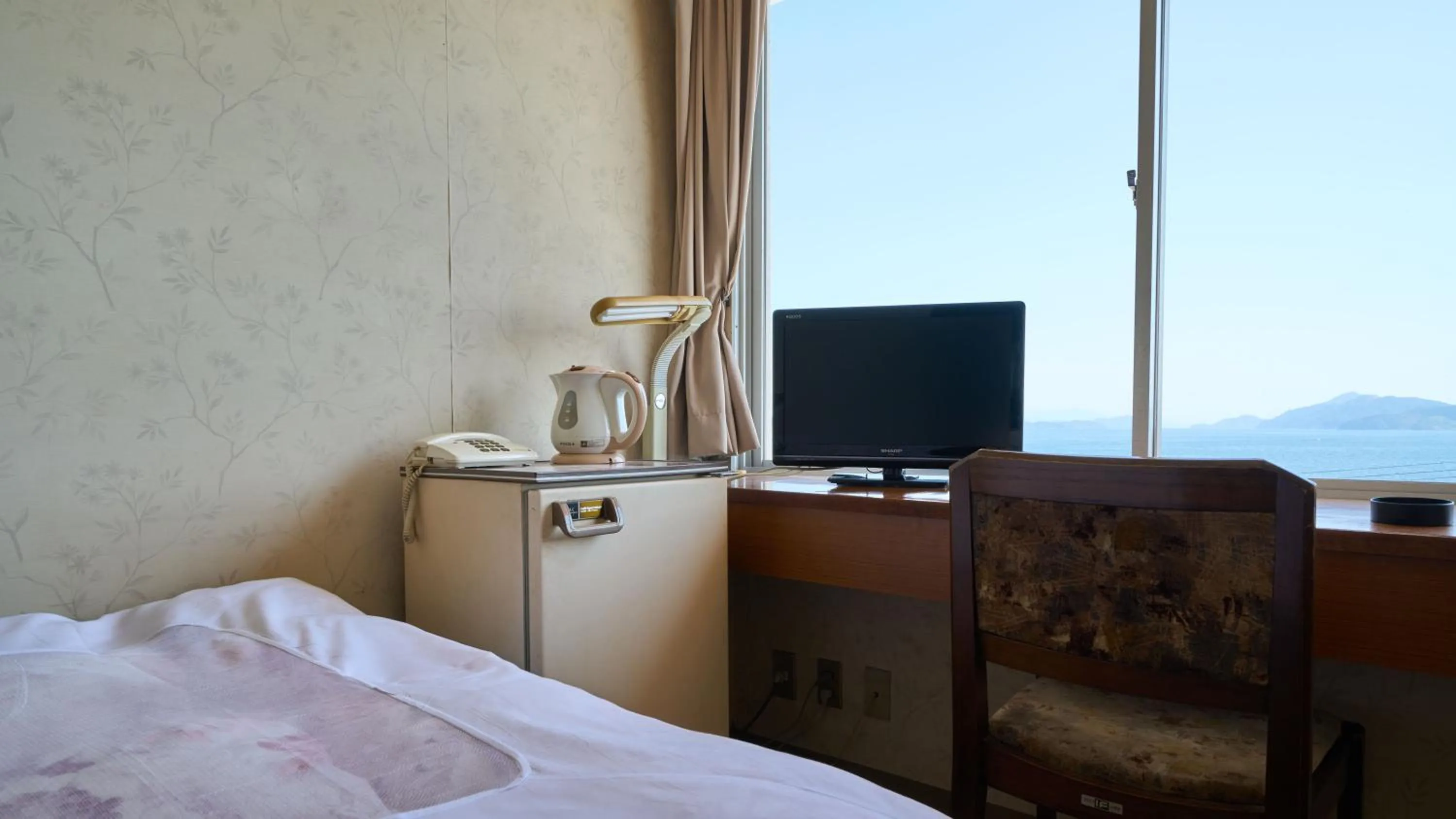 Photo of the whole room, Bed in Tabist Setouchinoyado Takehara Seaside