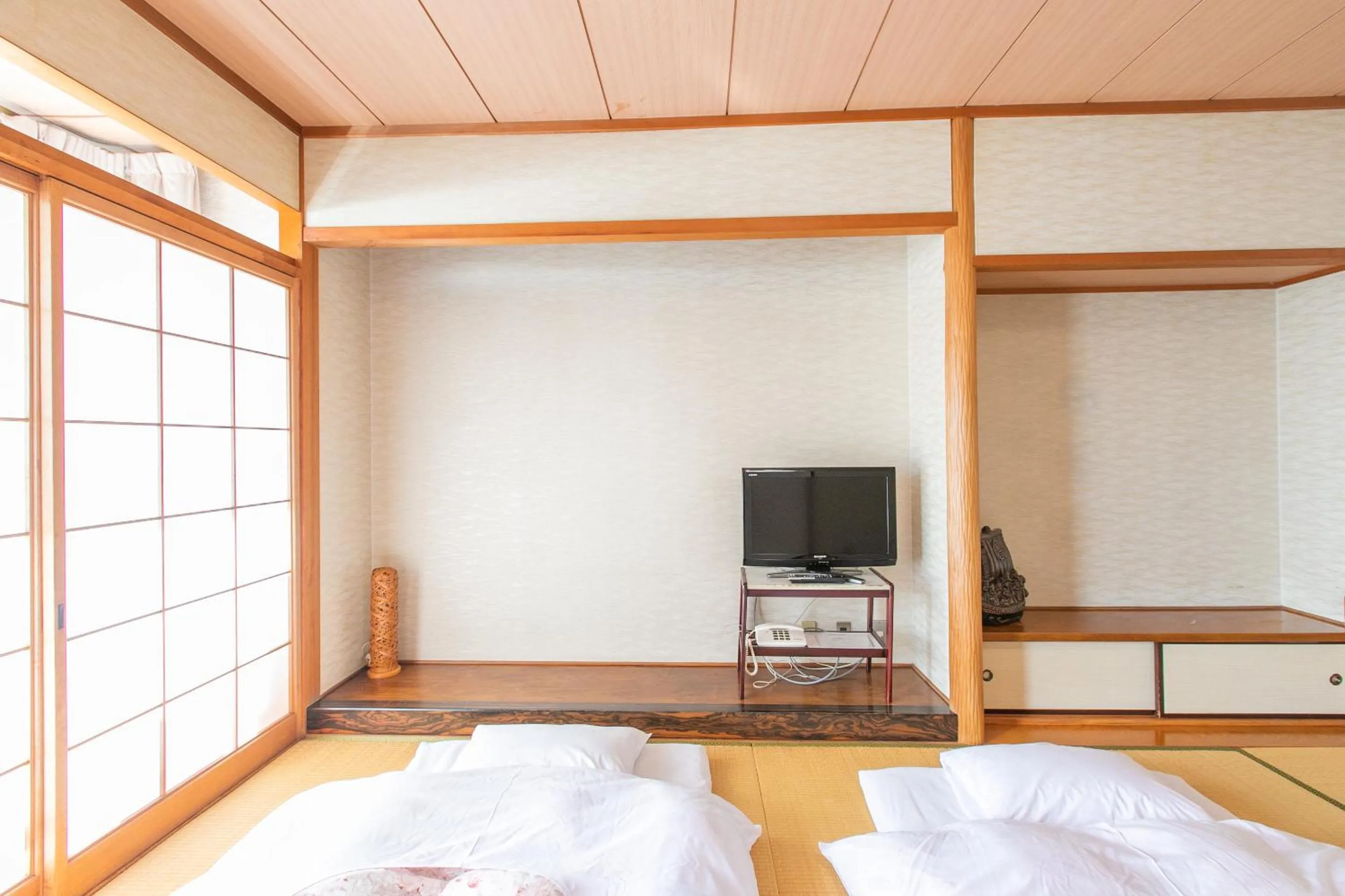 Photo of the whole room, Bed in Tabist Setouchinoyado Takehara Seaside