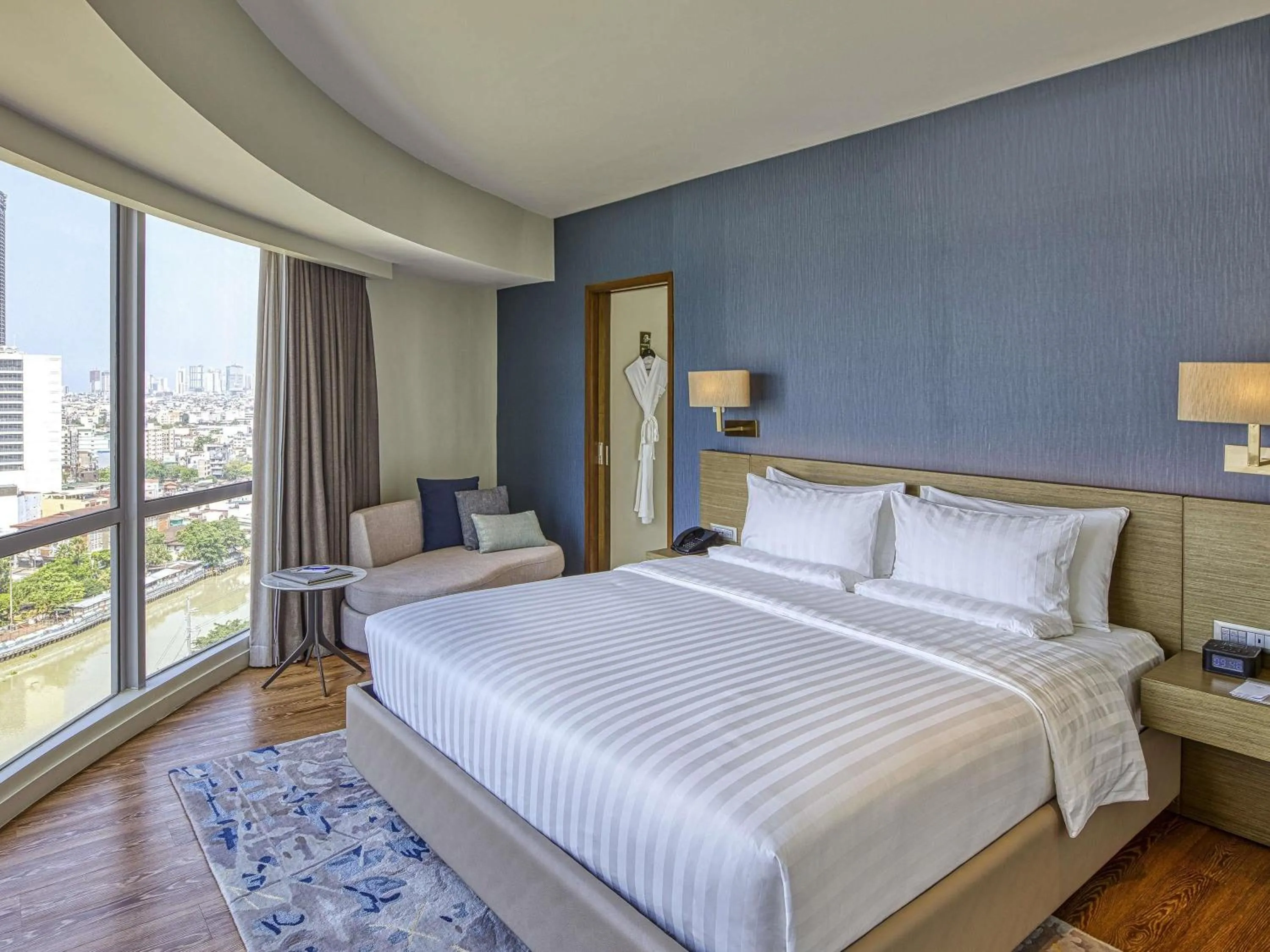 Photo of the whole room, Bed in Novotel Suites Manila at Acqua