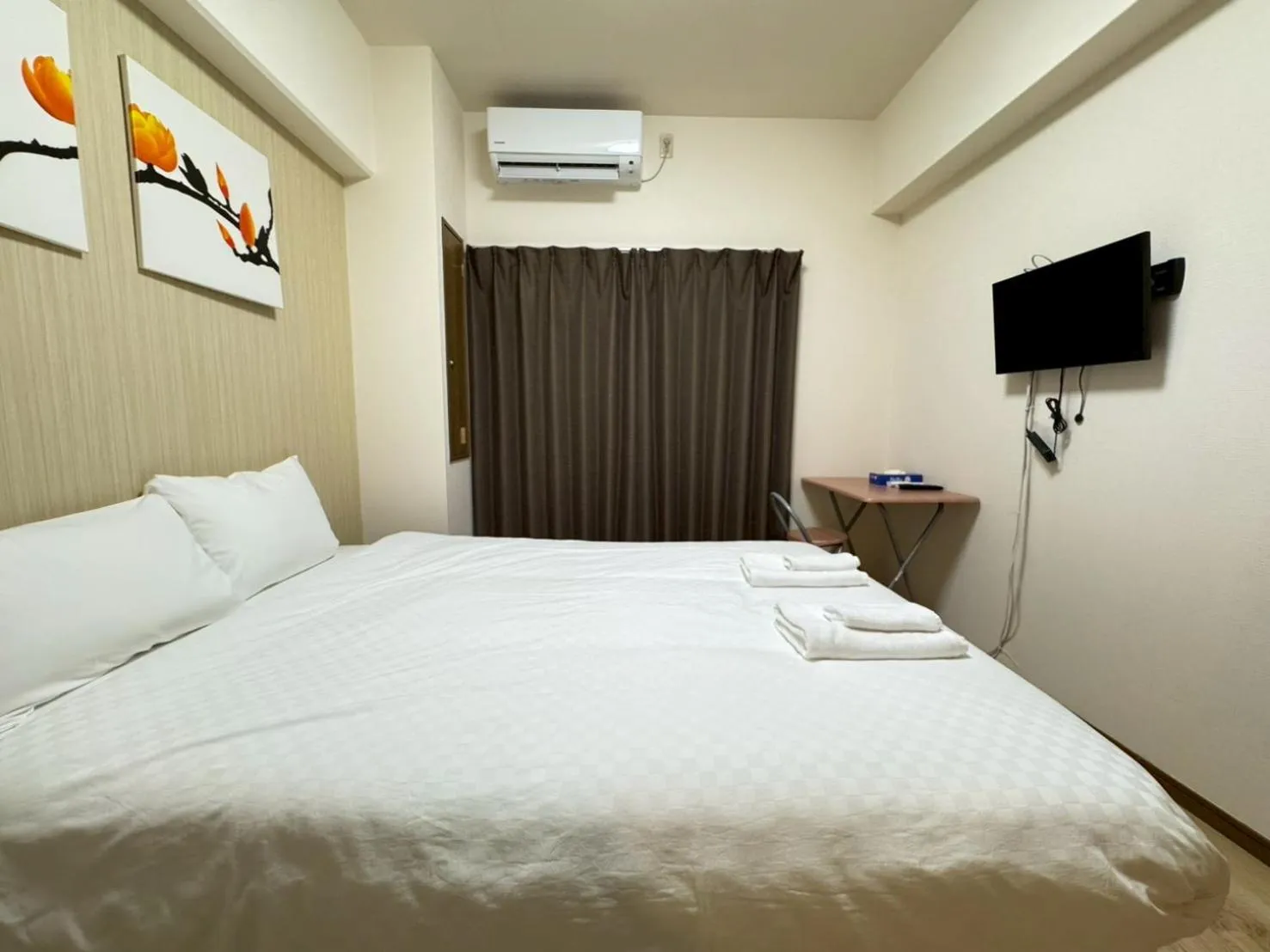 Bed in Sakura Sands Hotel