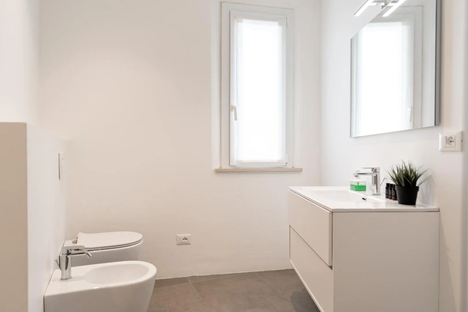 Toilet in Amare Suite & Apartments