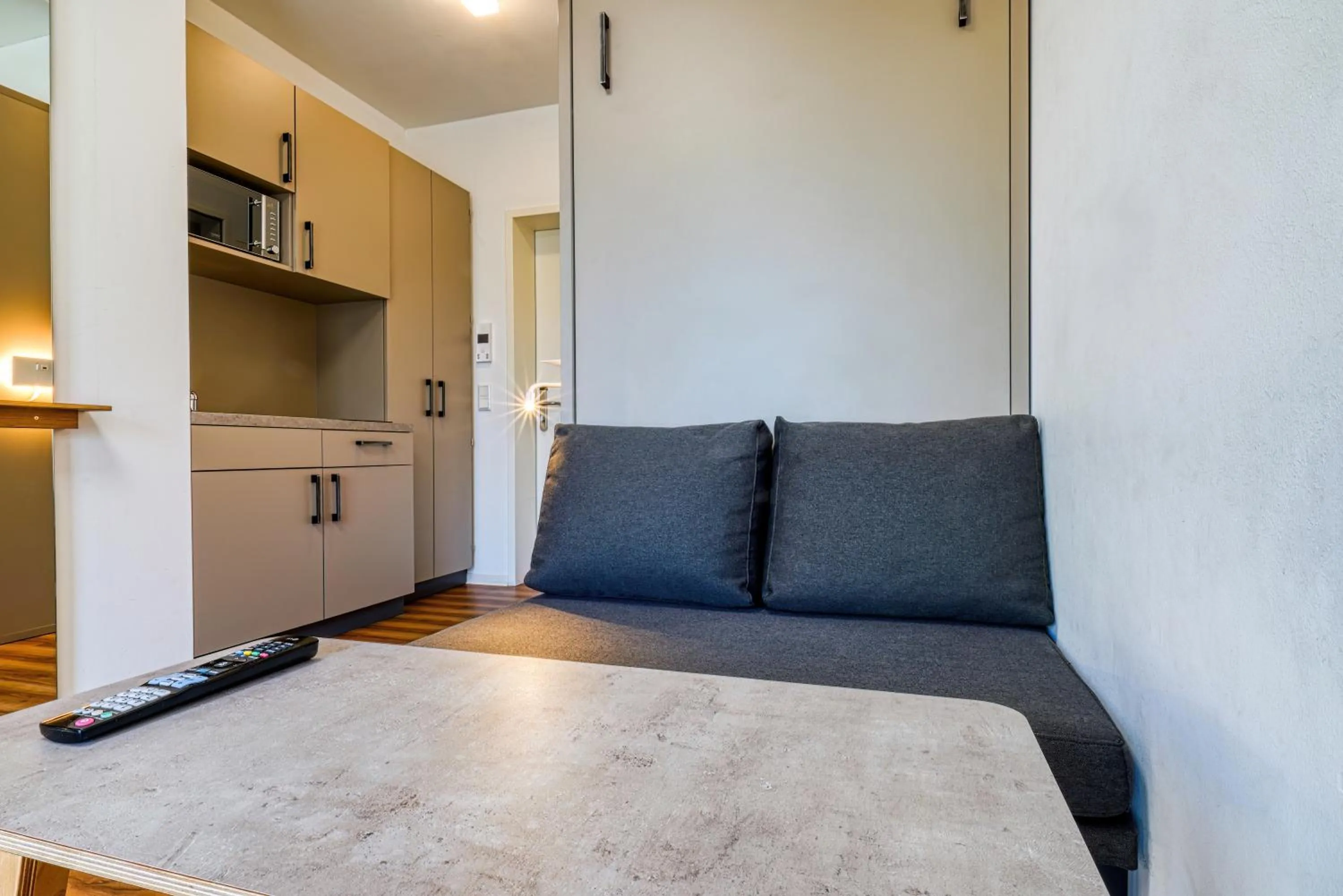 Seating area in NiceToStay by Fairway Hotels