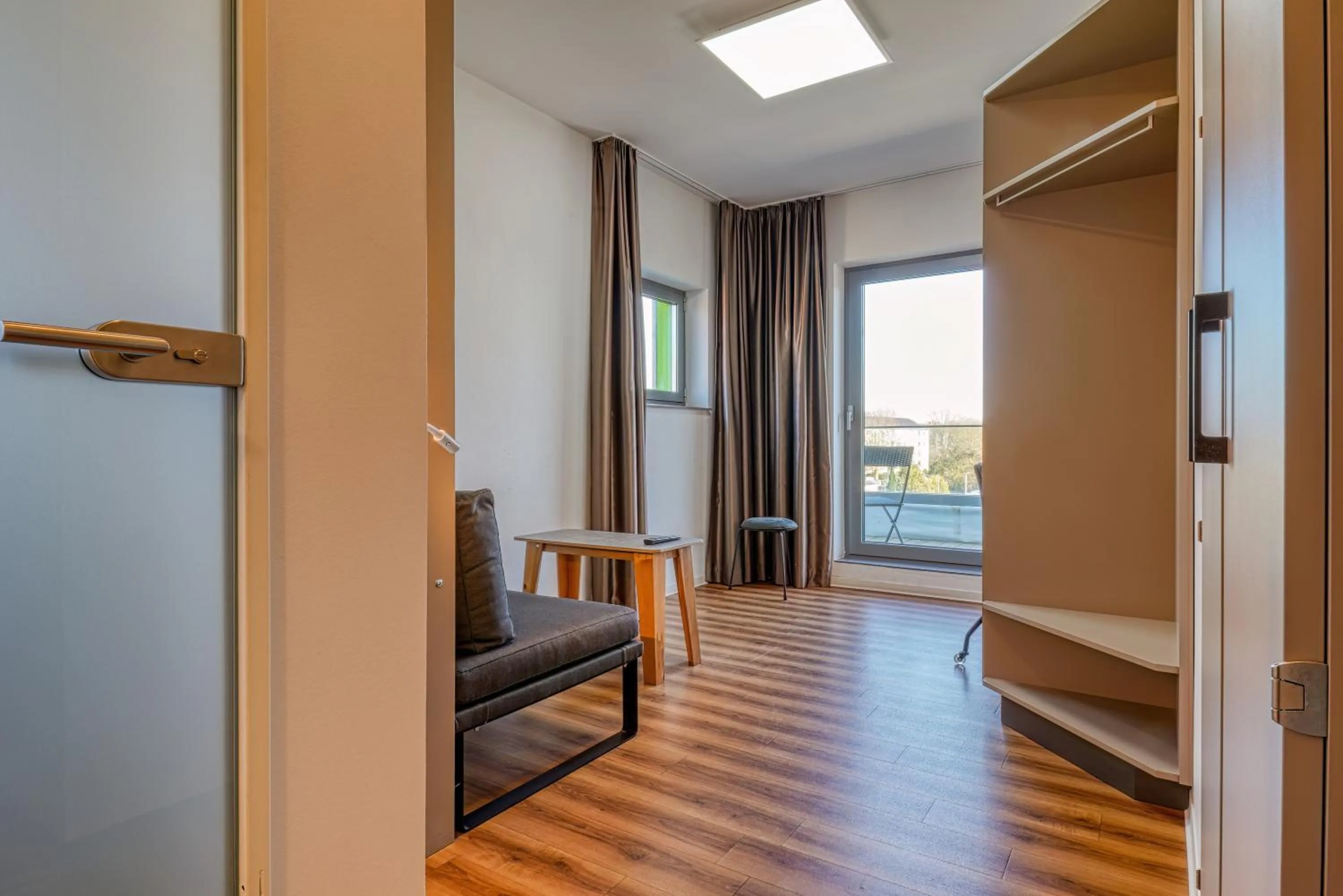 Living room, Bed in NiceToStay by Fairway Hotels