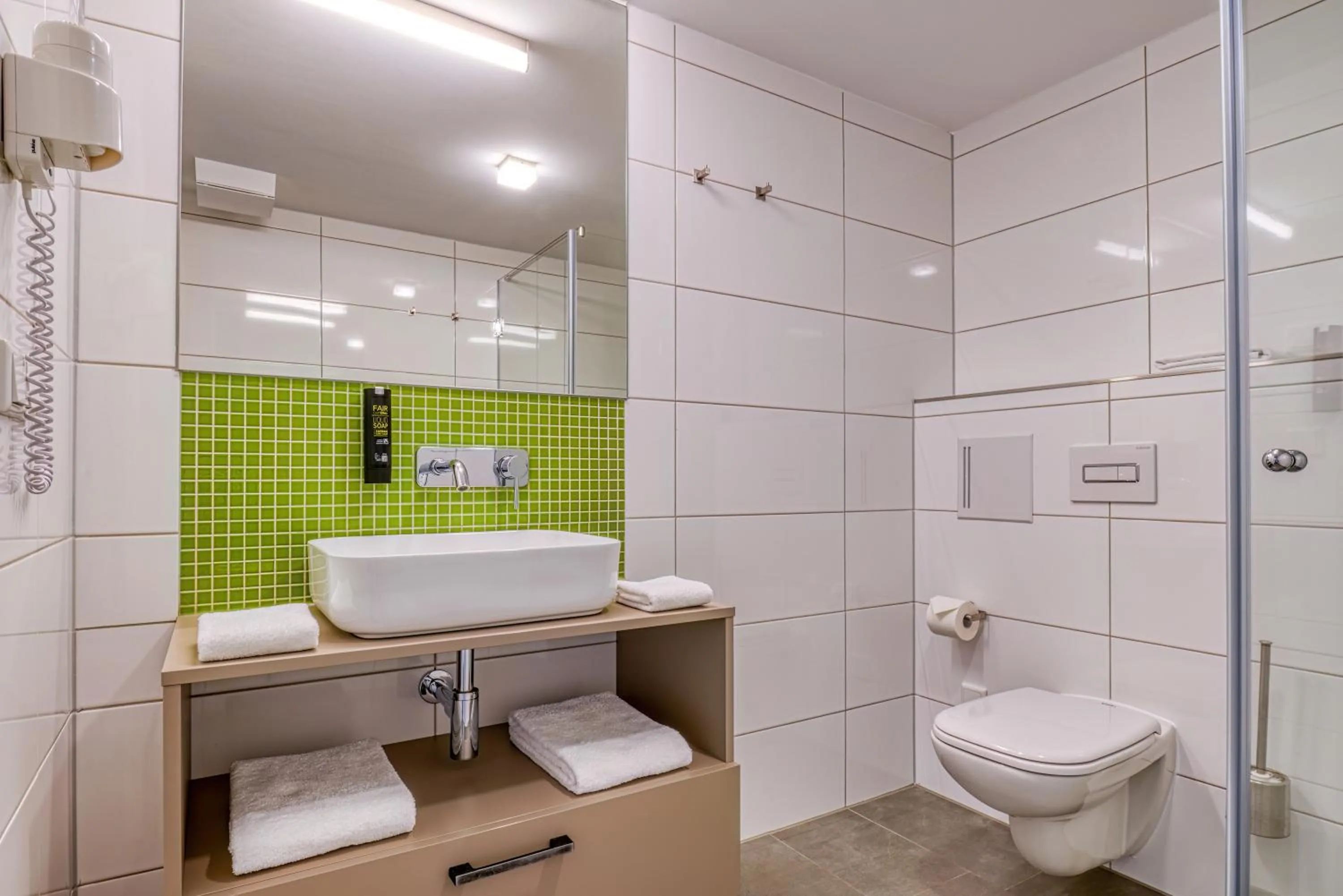Shower in NiceToStay by Fairway Hotels