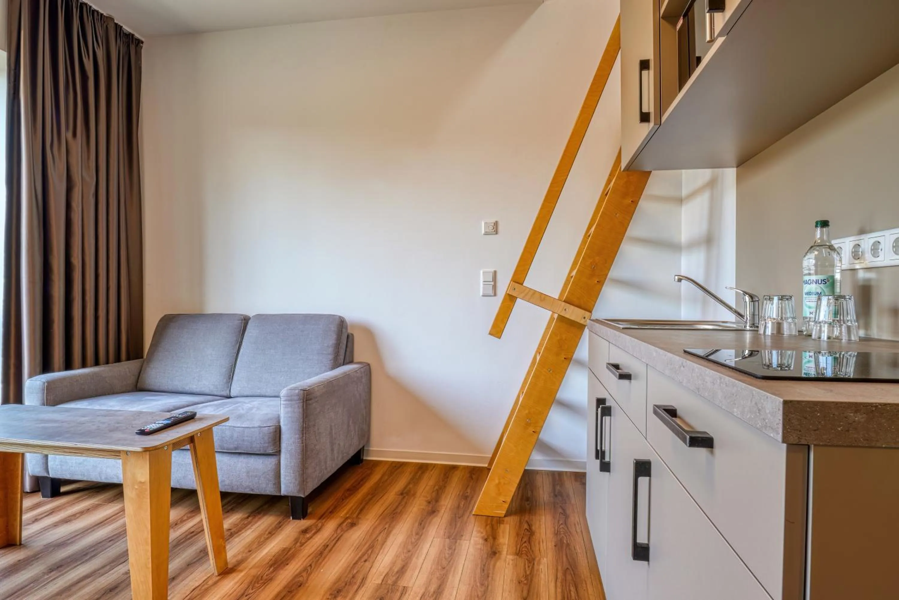 Seating area in NiceToStay by Fairway Hotels