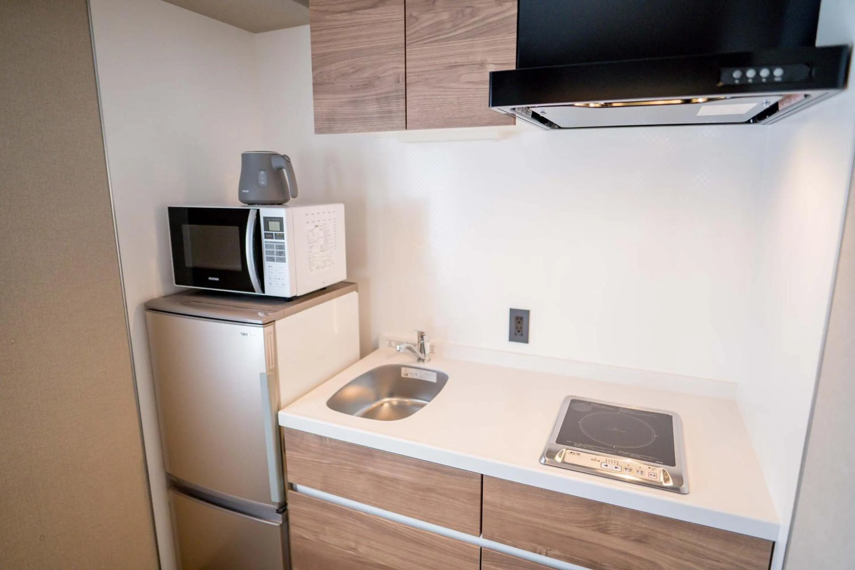 Kitchen or kitchenette in RESI STAY Hotel Sun Chlorella