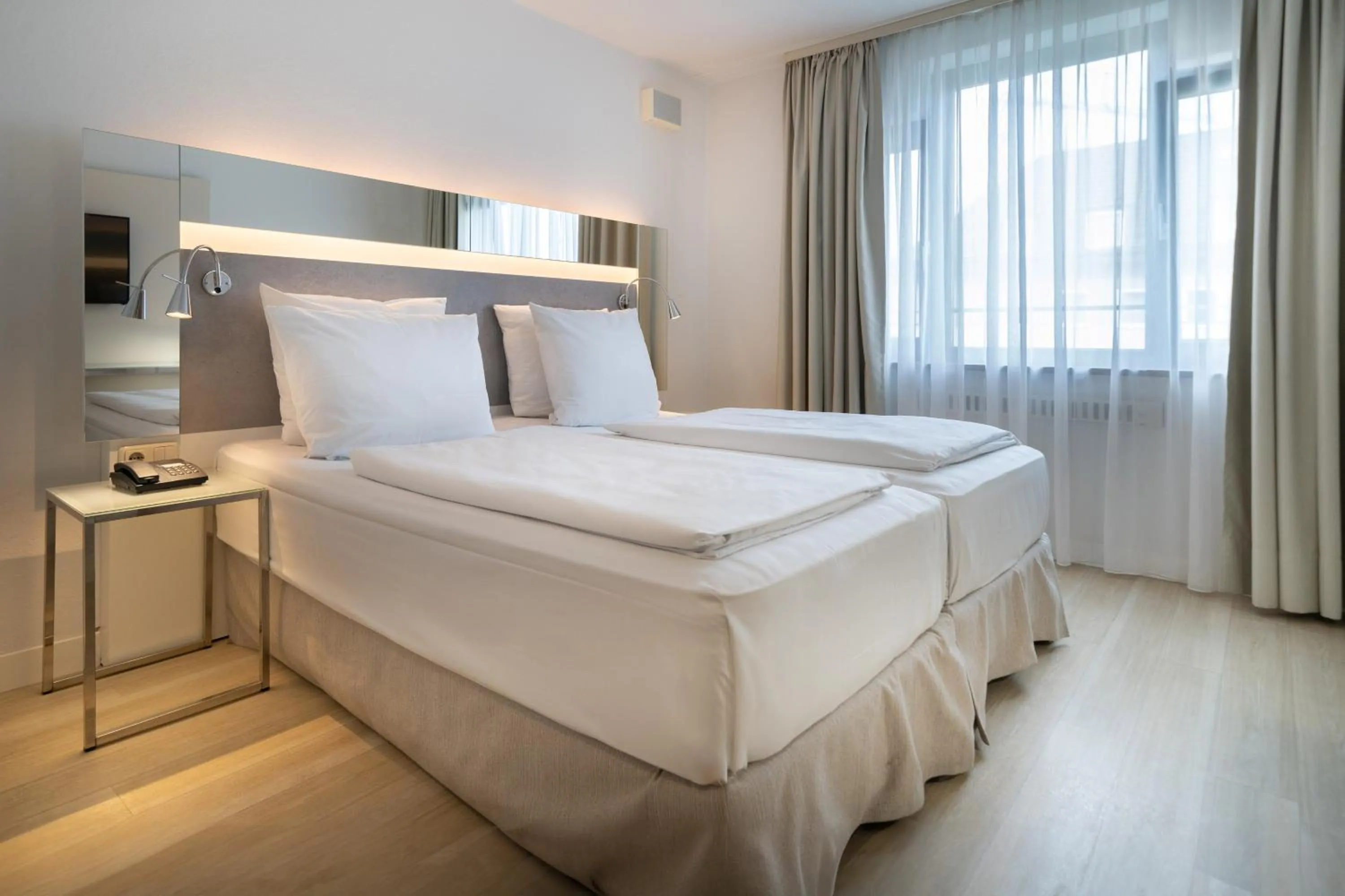 Bed in Hotel München City Center affiliated by Meliá