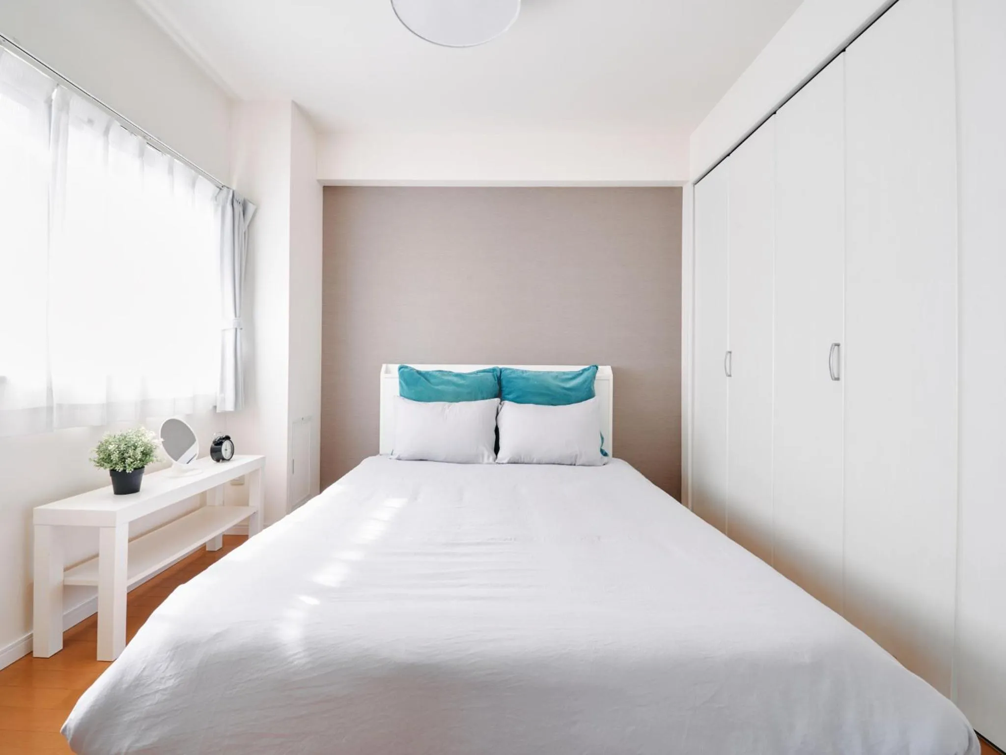 Bed in Nakano Apartment hotel