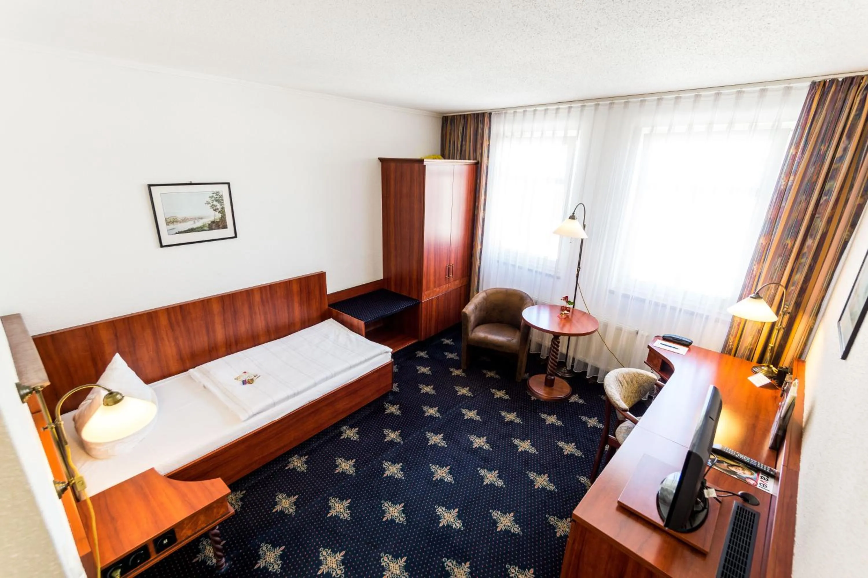 Photo of the whole room, Bed in Hotel Wilder Mann Annaberg-Buchholz