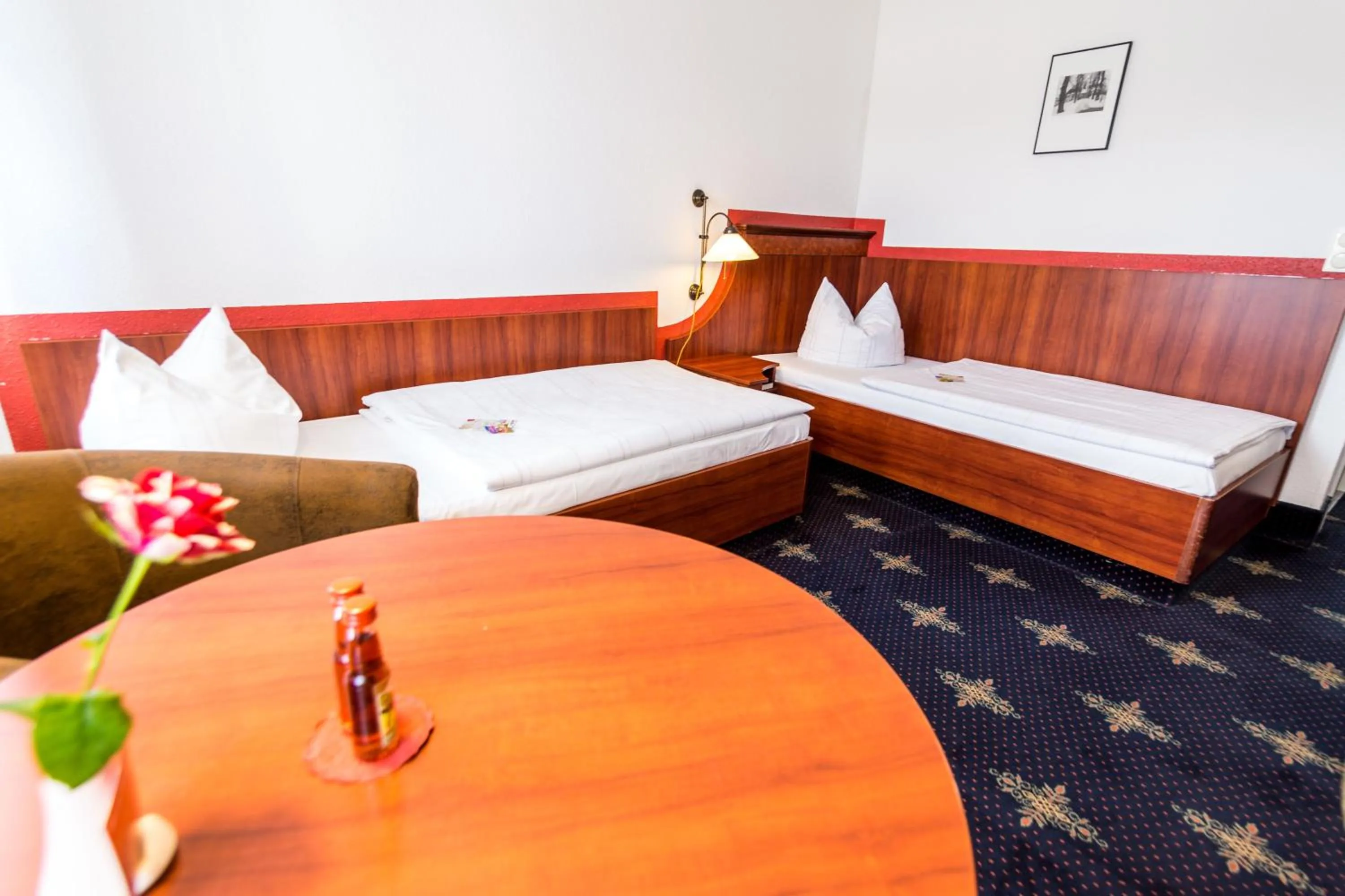 Photo of the whole room, Bed in Hotel Wilder Mann Annaberg-Buchholz