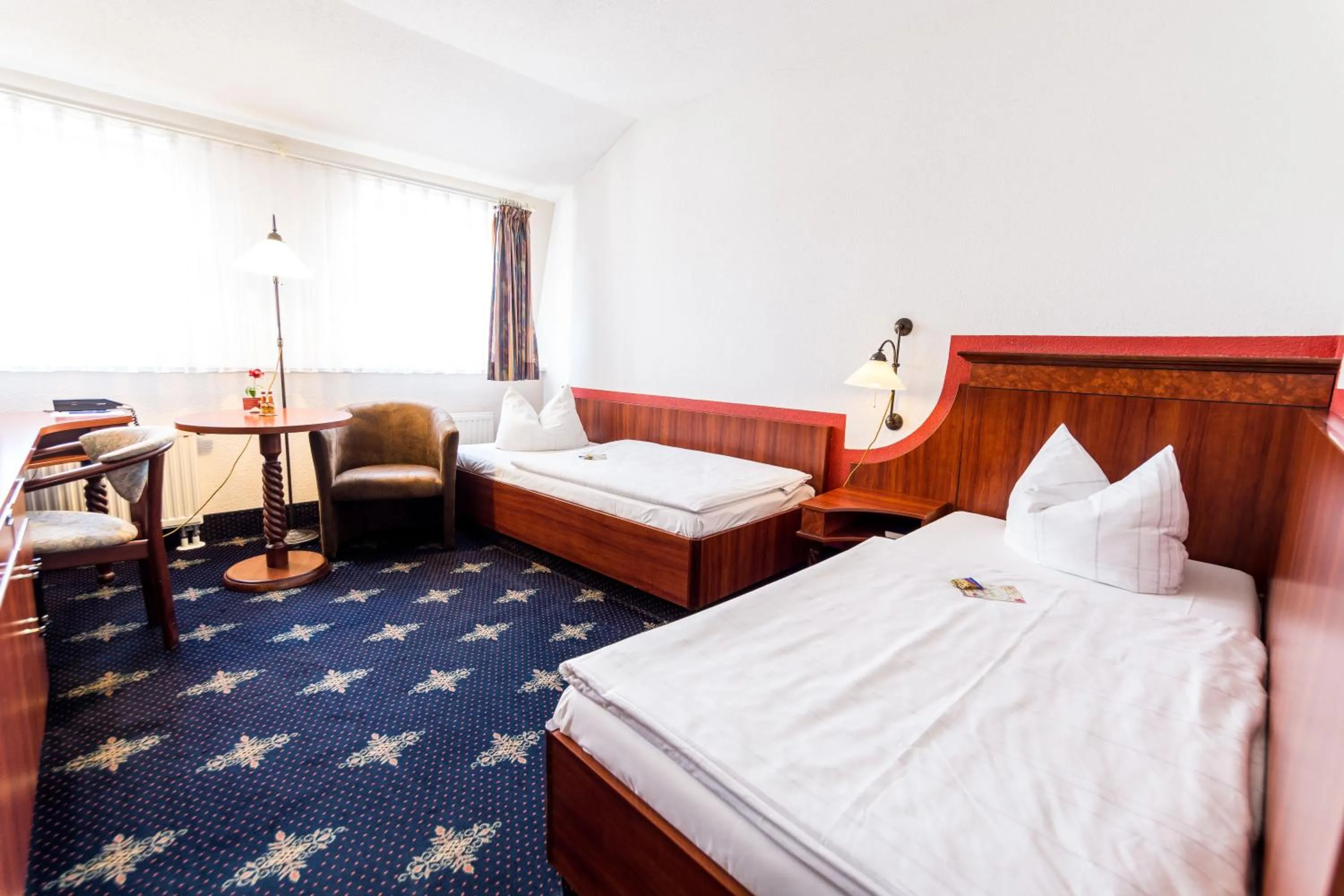 Photo of the whole room, Bed in Hotel Wilder Mann Annaberg-Buchholz