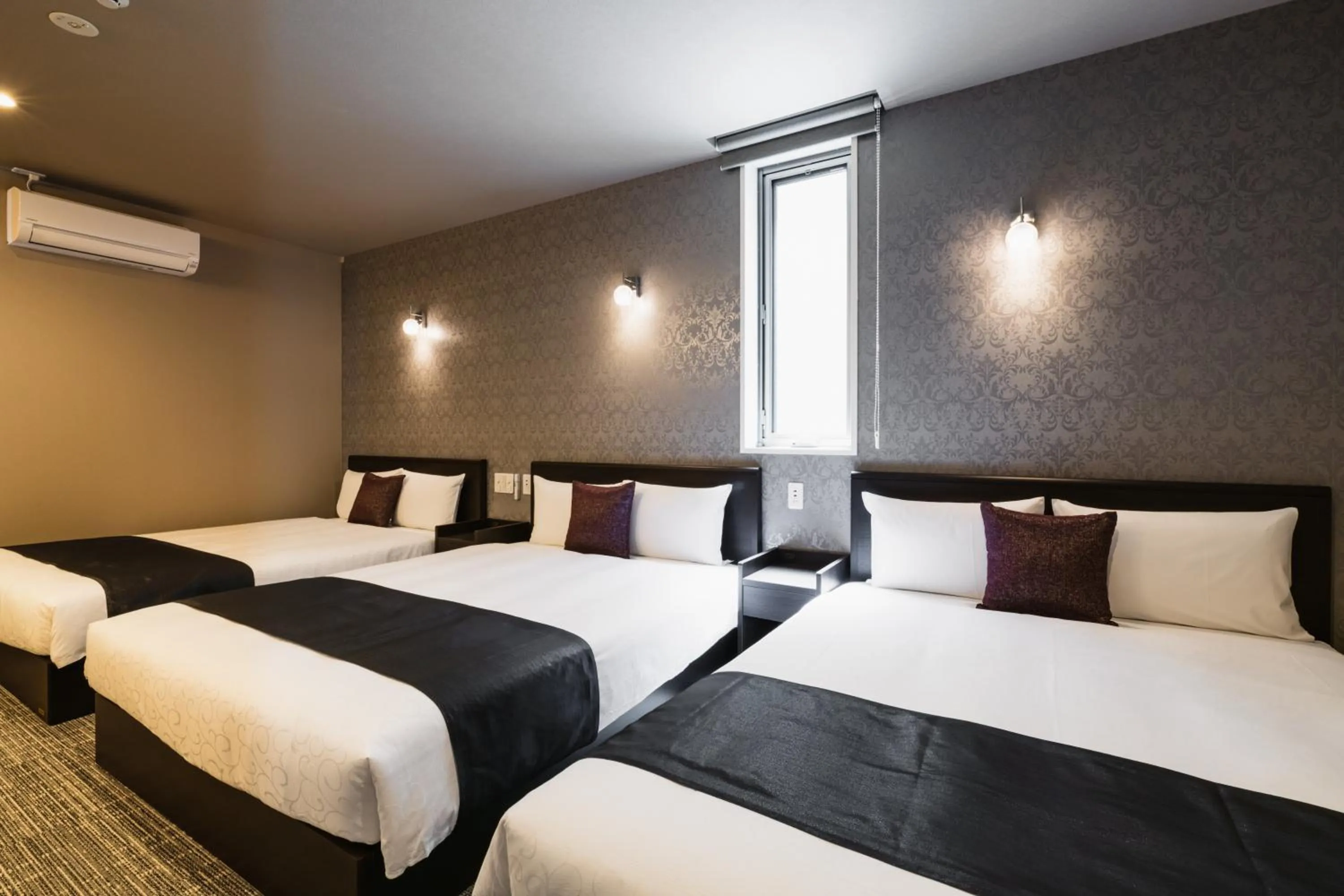 Bed in GRAND BASE Yakuin Odori