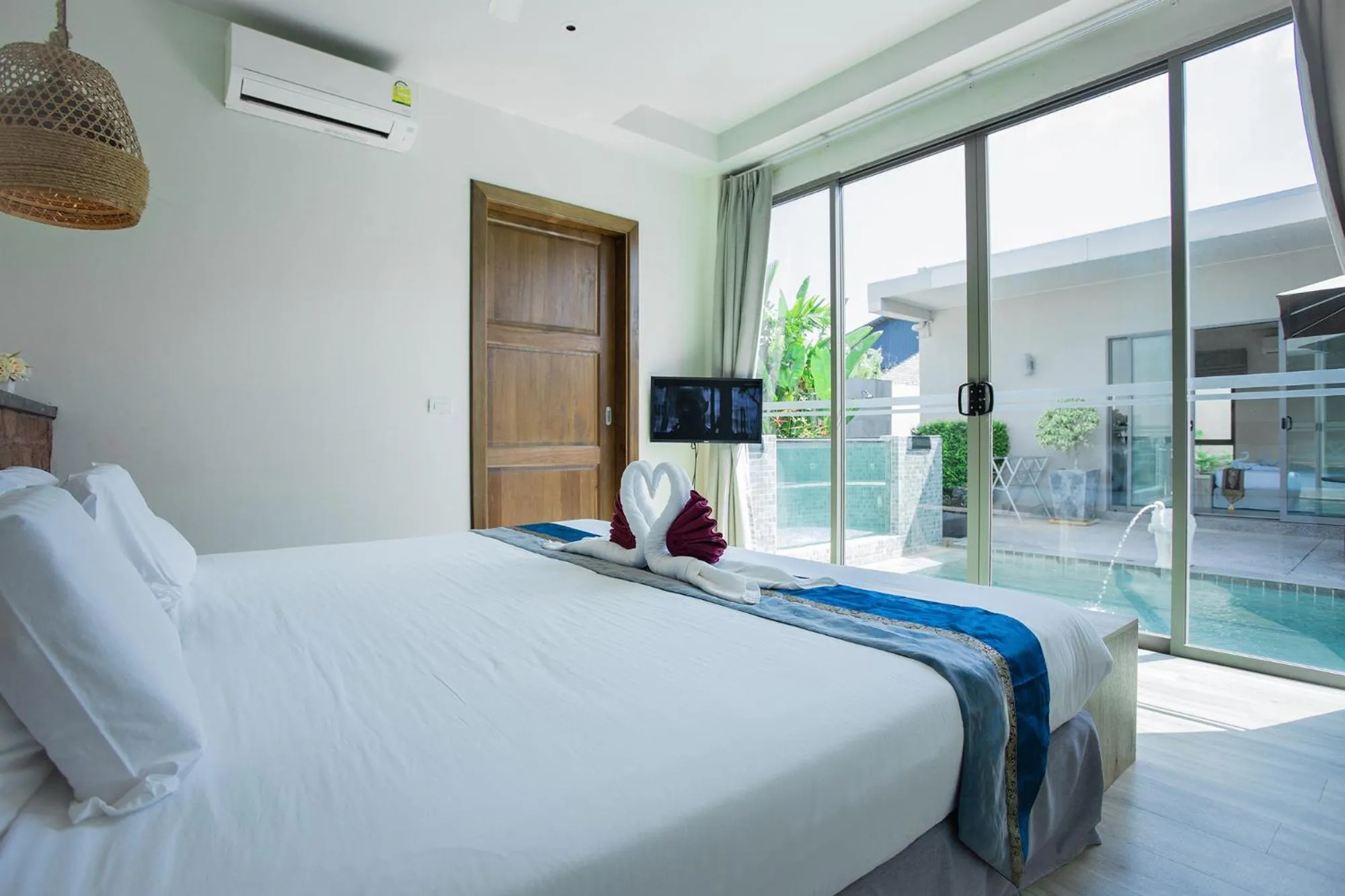 Bed in Yipmunta Pool Villa - SHA Plus Certified