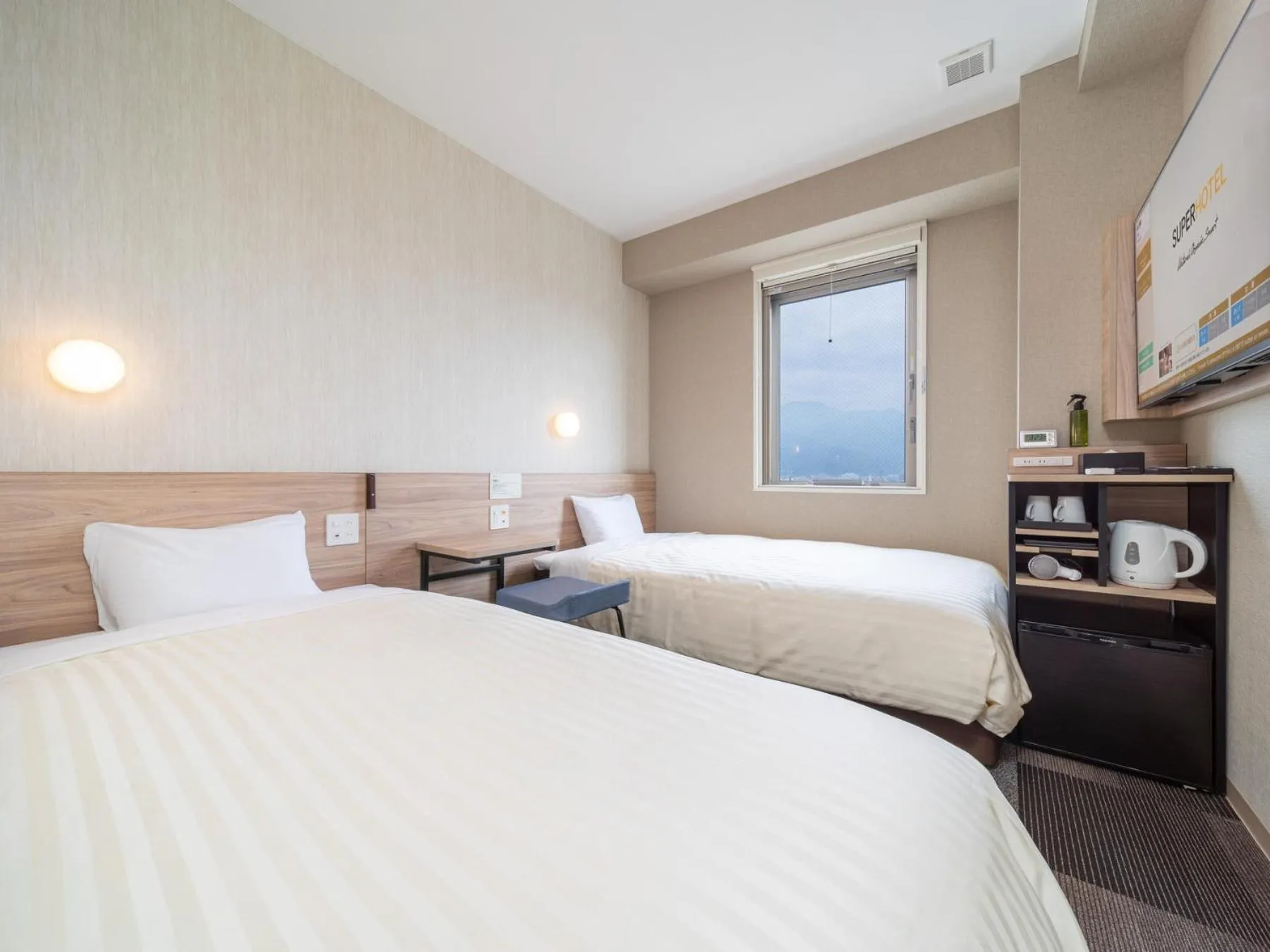 Bed in Super Hotel Iyo Saijo