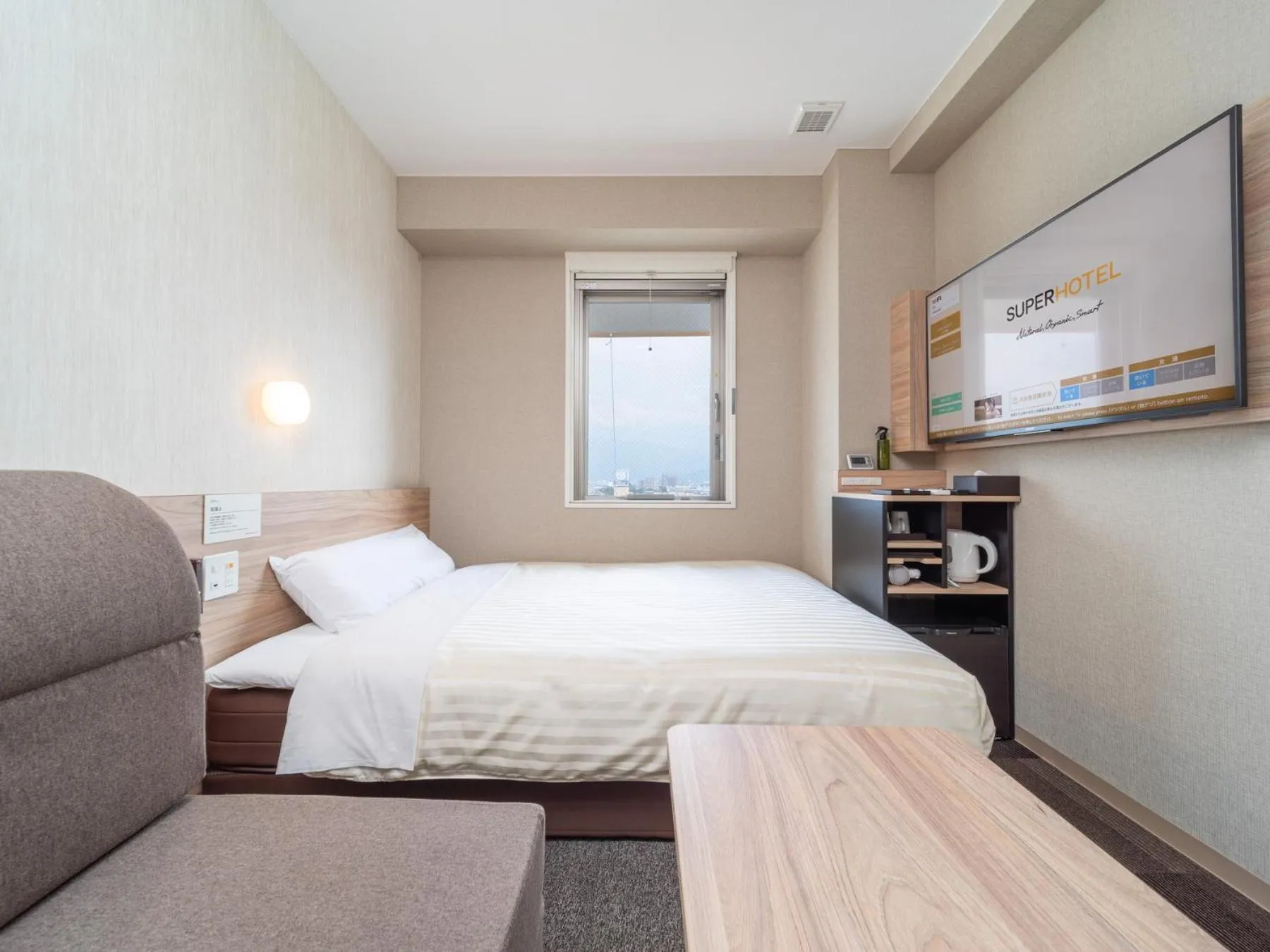 Bed in Super Hotel Iyo Saijo