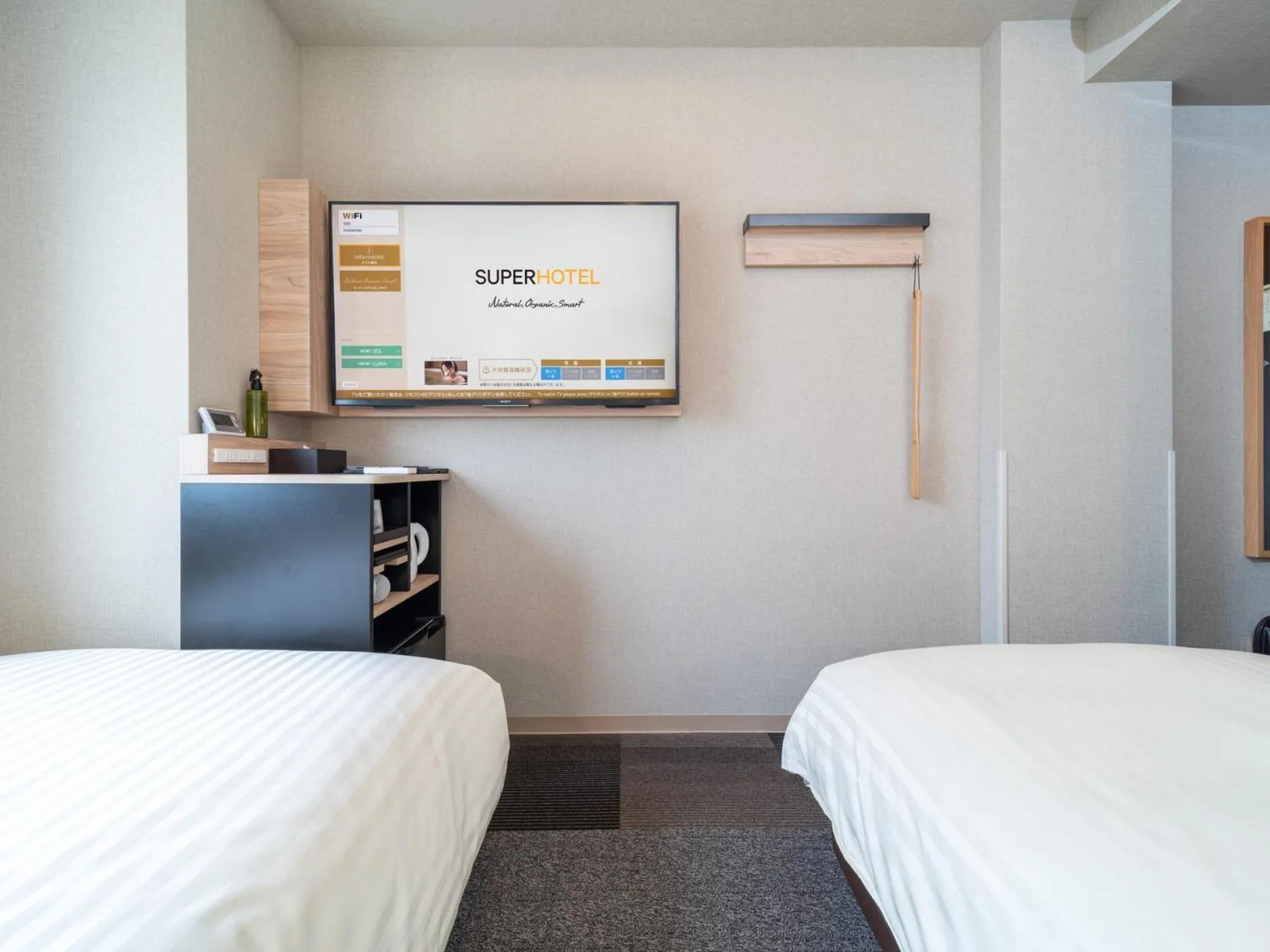 Bed in Super Hotel Iyo Saijo