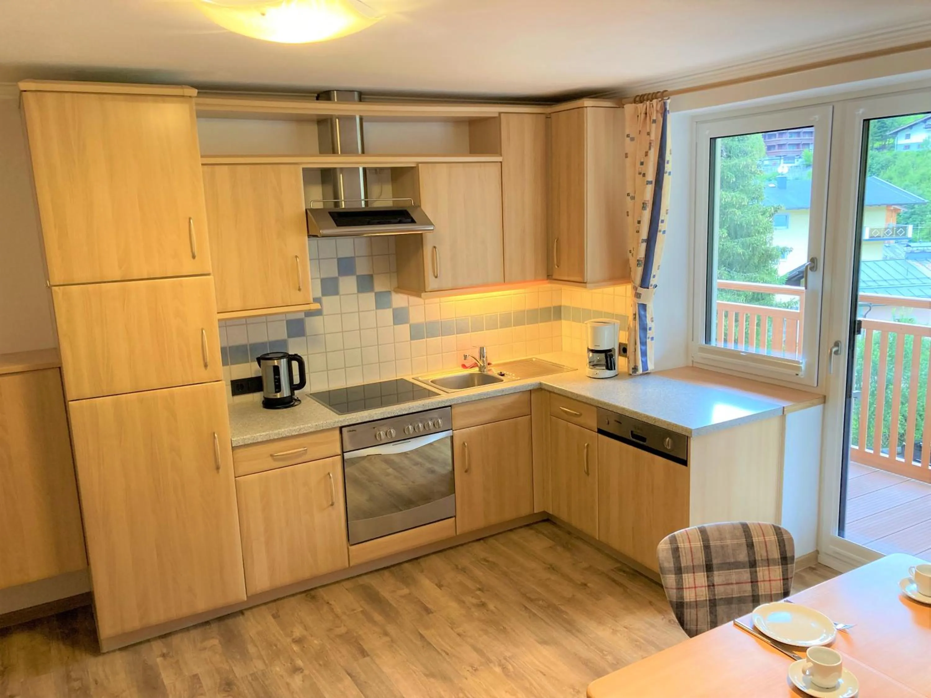 kitchen in Hotel Garni Siegmundshof - inclusive Joker Card im Sommer