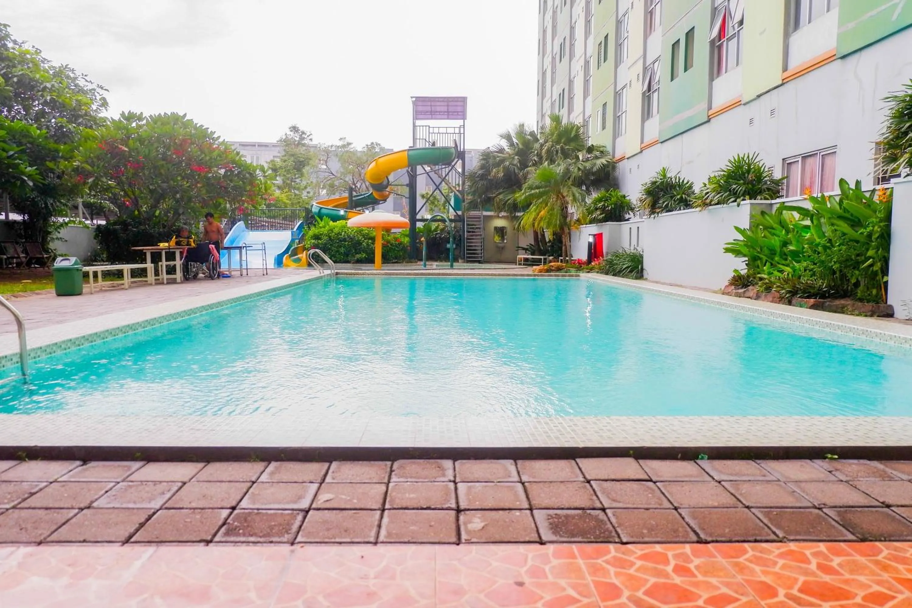 Swimming pool in Minimalist 2BR Apartment at Dian Regency By Travelio