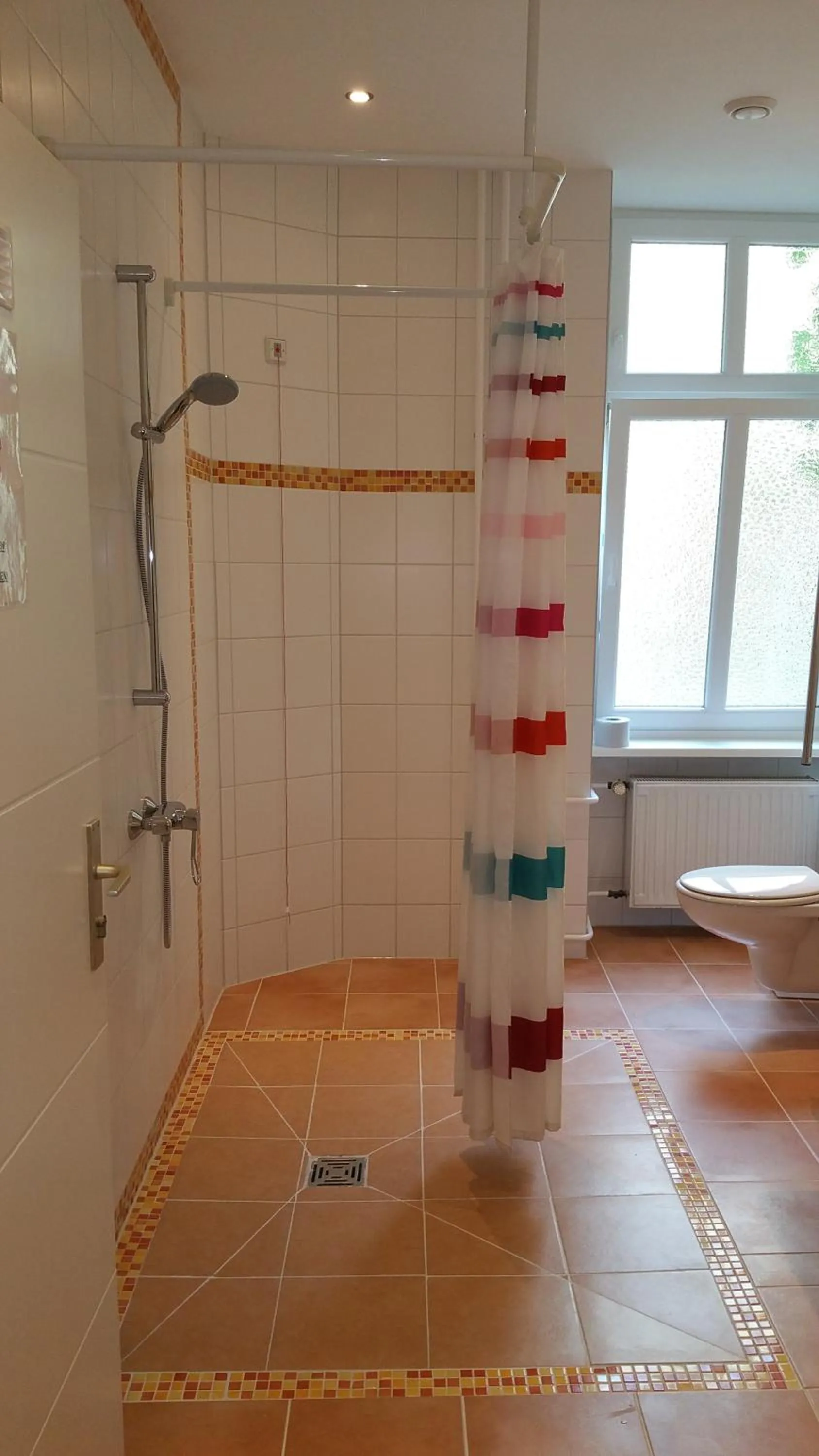 Bathroom in Happy Go Lucky Hotel + Hostel