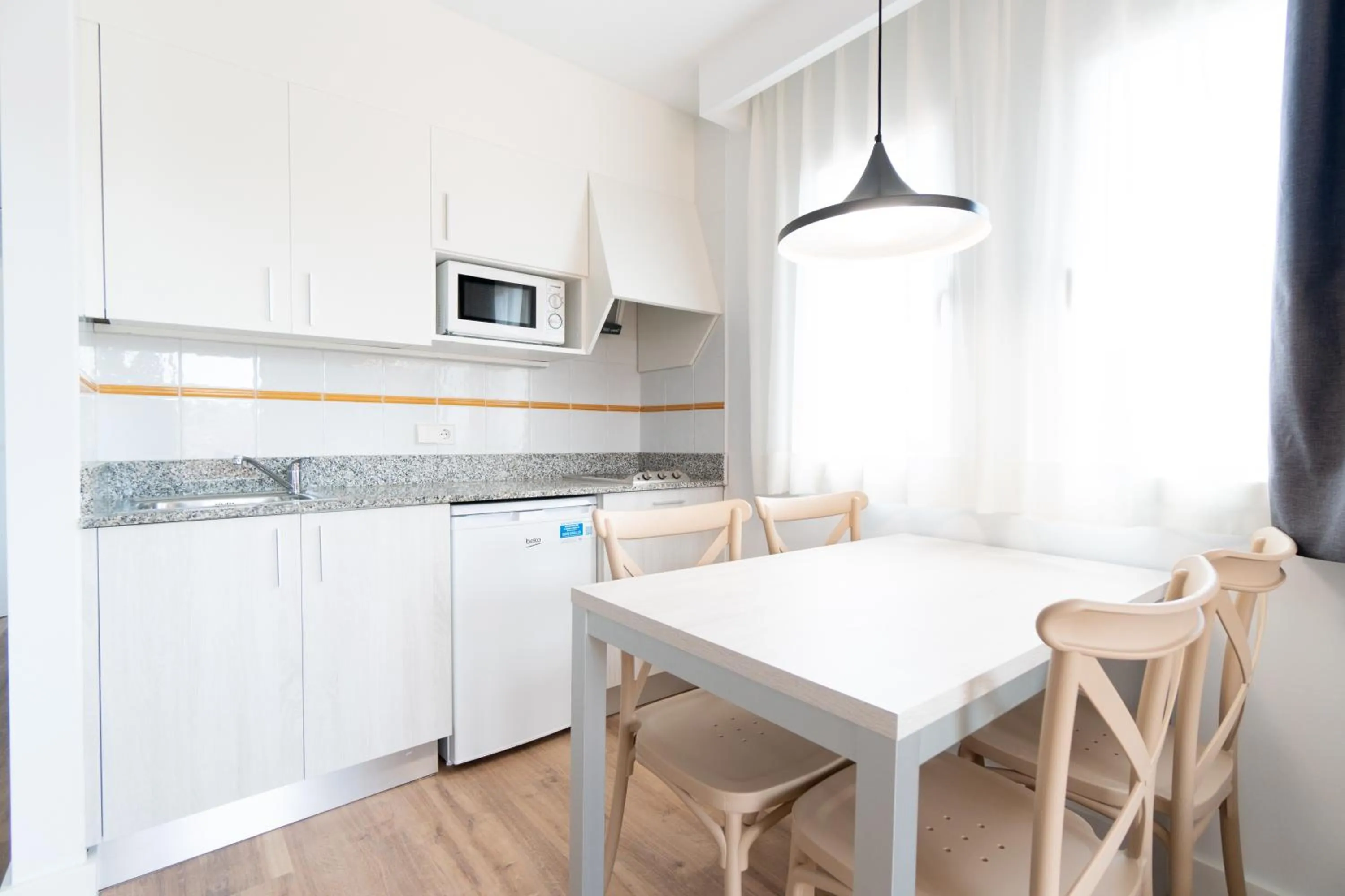 Kitchen or kitchenette in Aparthotel Ciudad Laurel