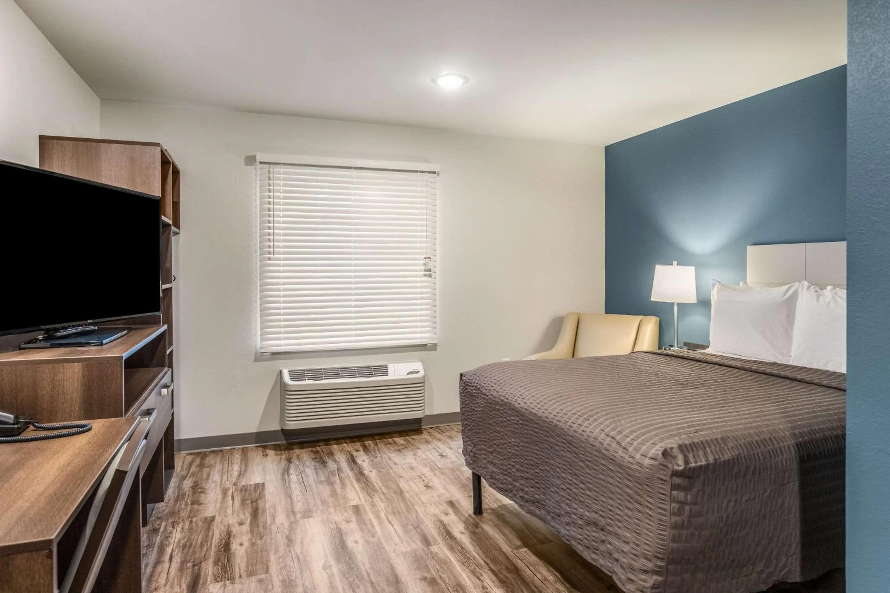 Photo of the whole room, Bed in WoodSpring Suites Greenville Haywood Mall